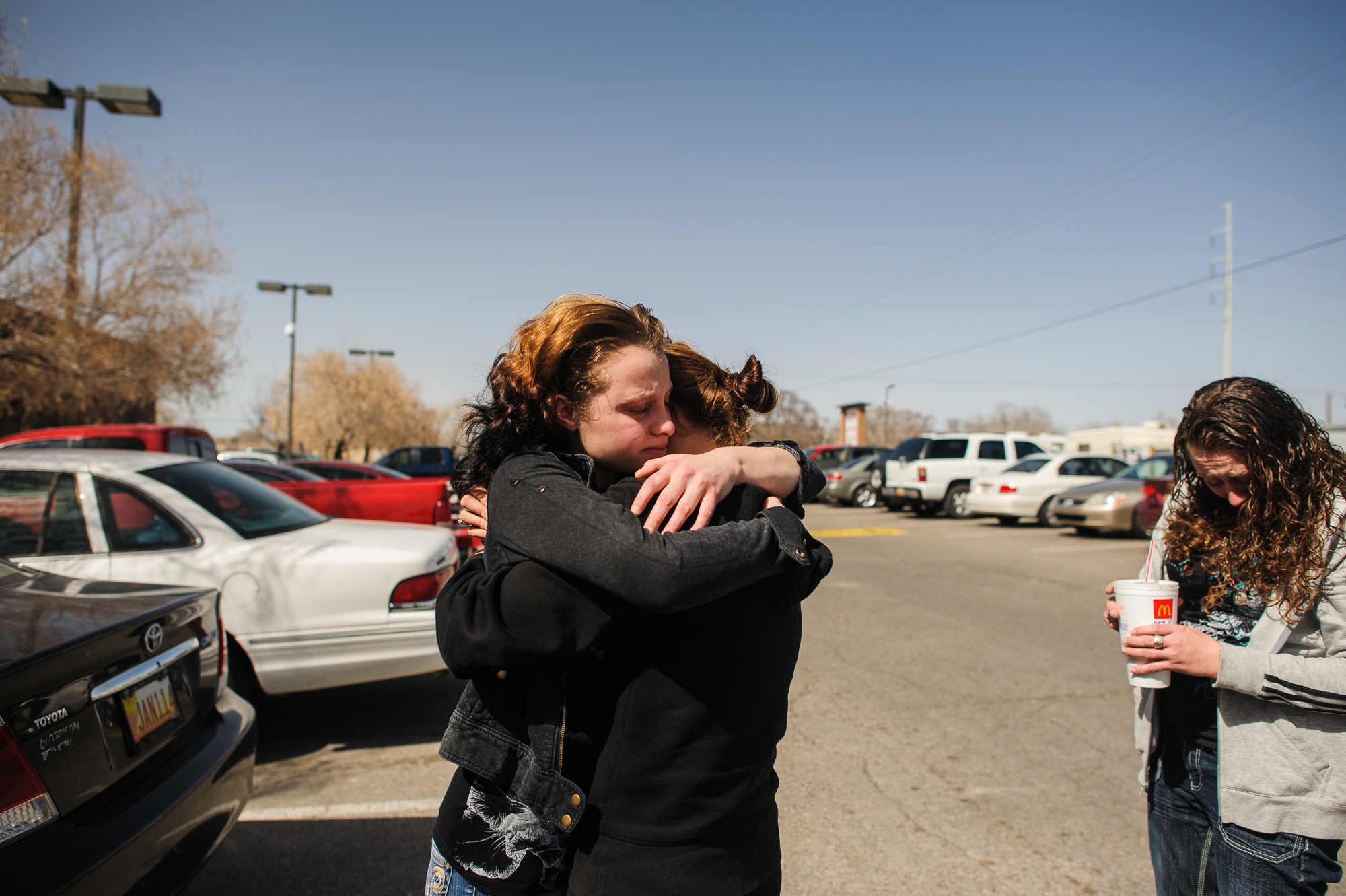  Alysia cries and hugs her cousin, while her mother, Anastasia, (right) stands and cries. Alysia is given 10 minutes to hug her cousin and her mother before being transferred to a court-ordered treatment facility for 6 months where she will focus on 