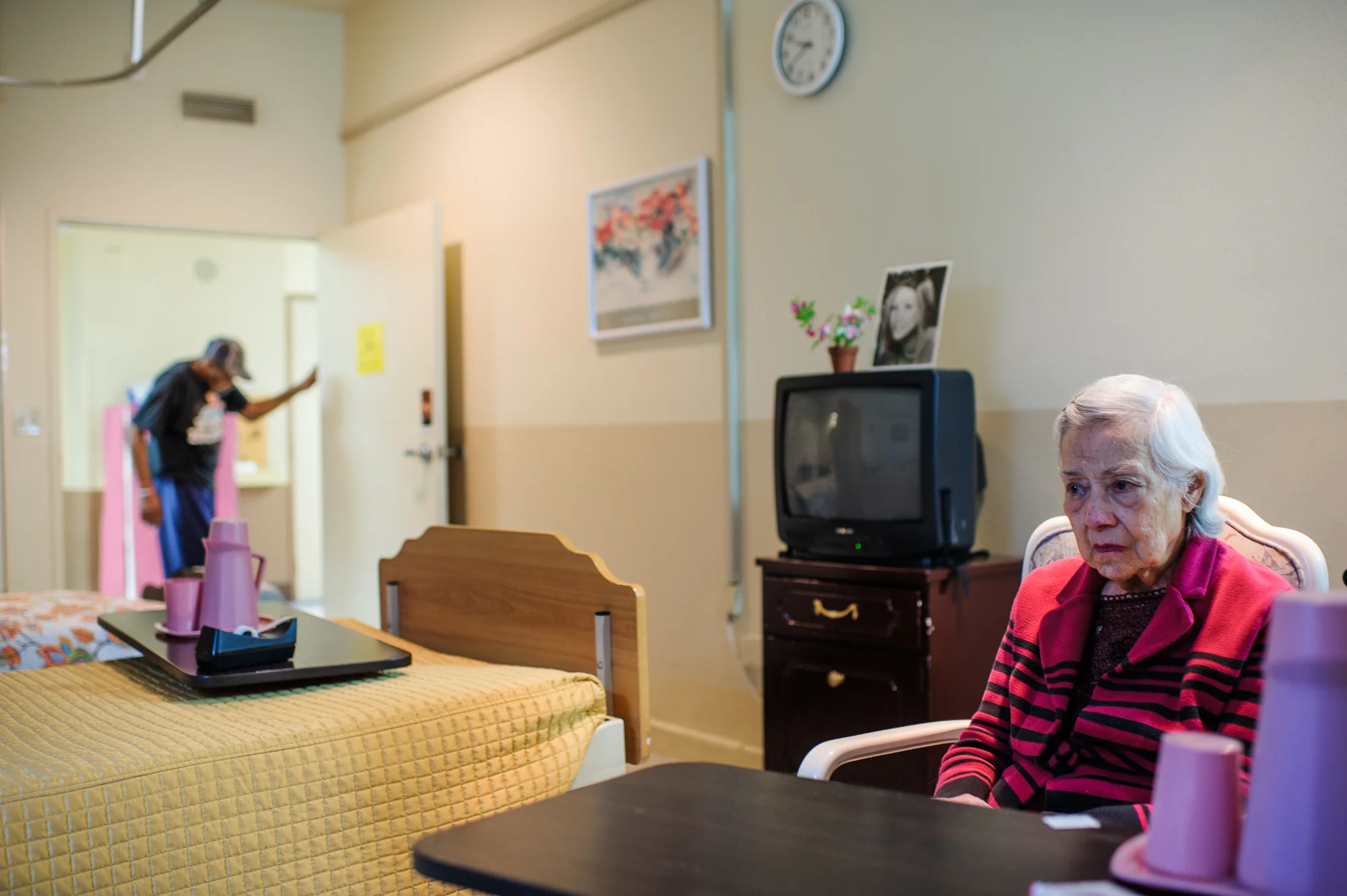 Bianca, age 88, sits in her room in a locked memory care ward after her prior retirement home administrator decided to move her elsewhere, 2013.
