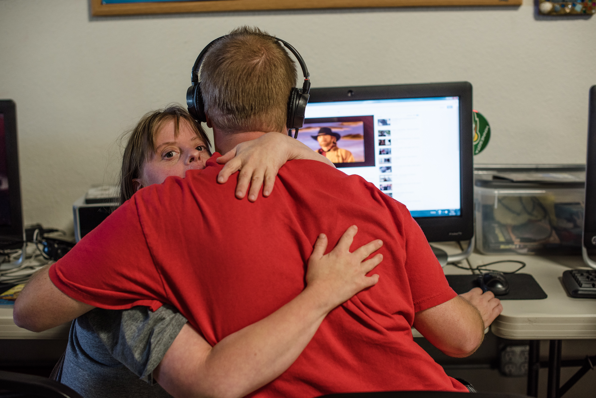  Krysta holds Nathaniel, as he watches a video during the workshop they attend daily.  