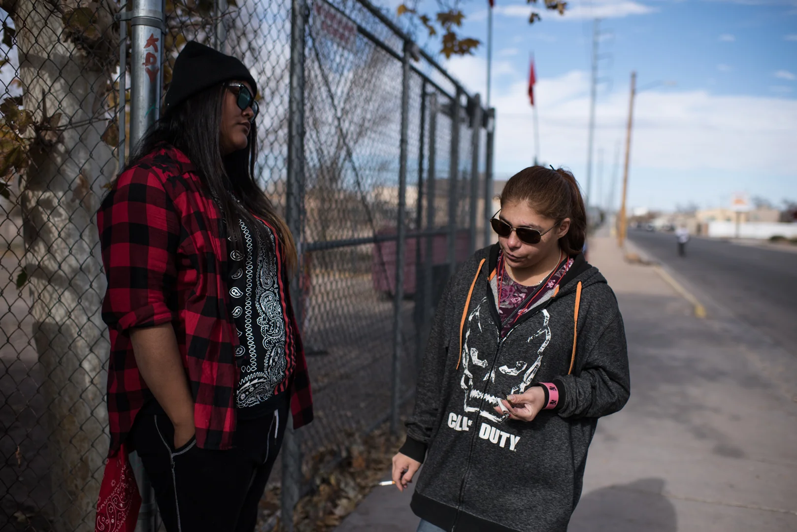 Delilah stands with Naynay, a friend, outside a homeless day shelter in Albuquerque.