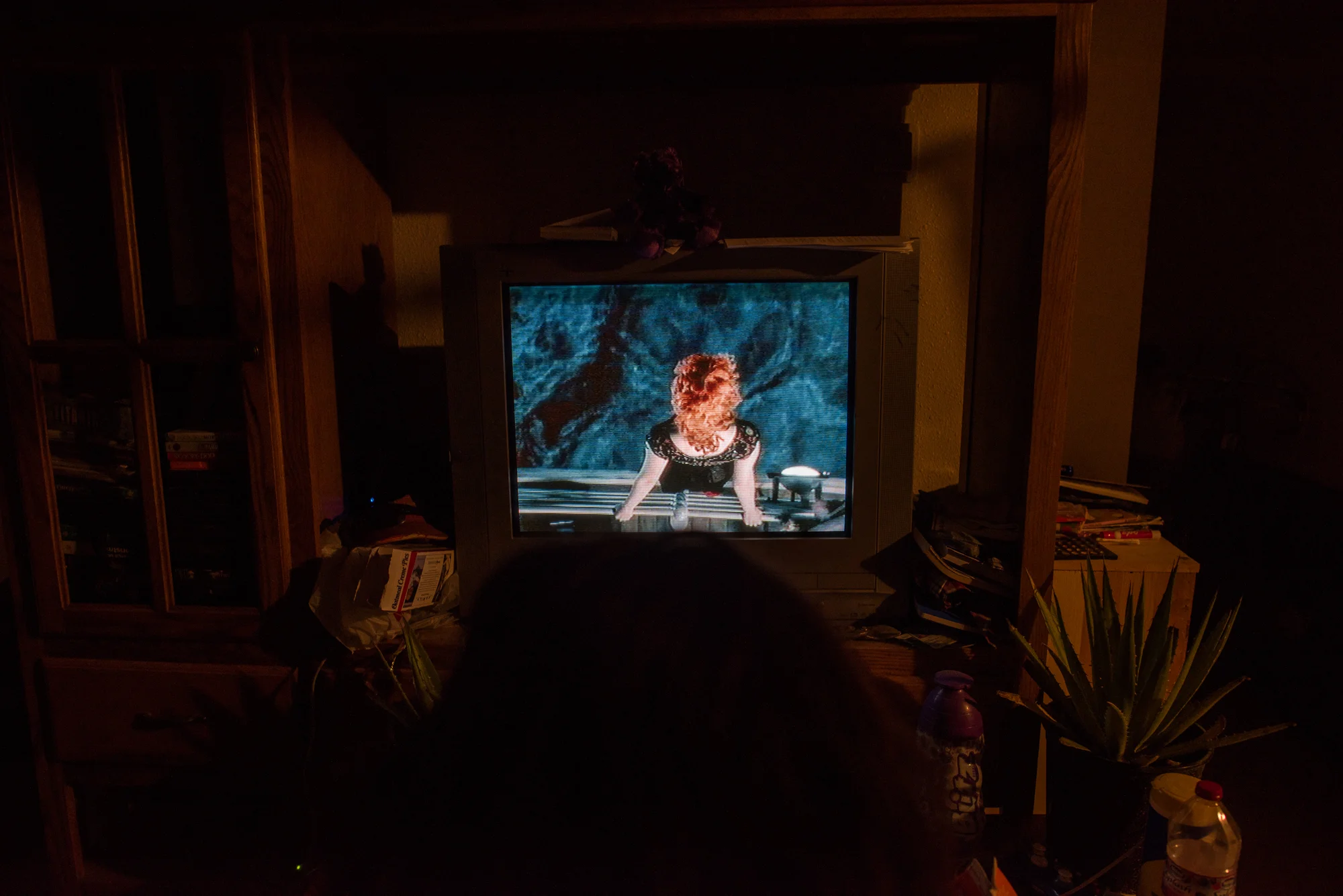 Delilah watches Titanic while Alex works graveyard shift at the gas station.