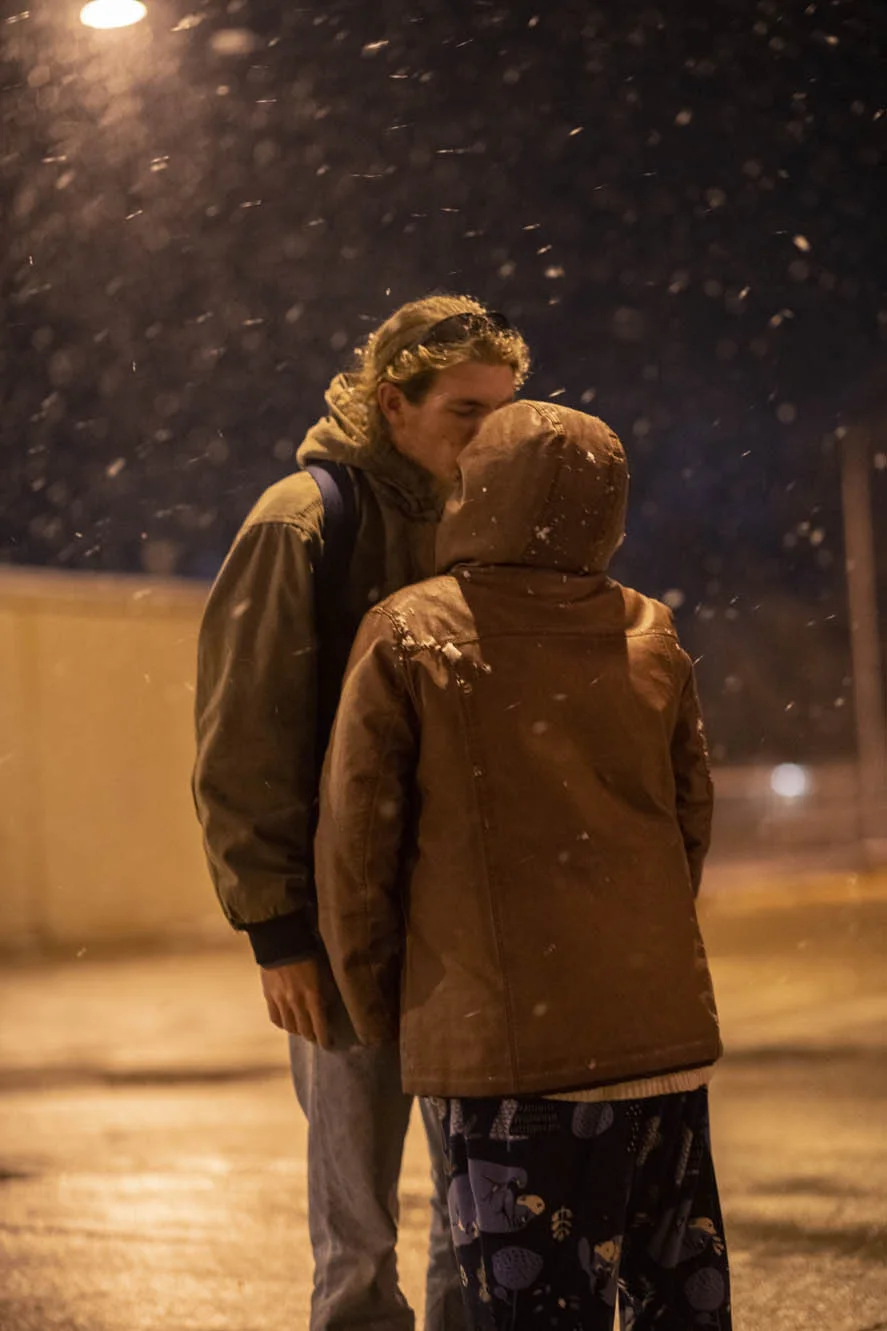 Alex and Delilah kiss in a snowstorm.