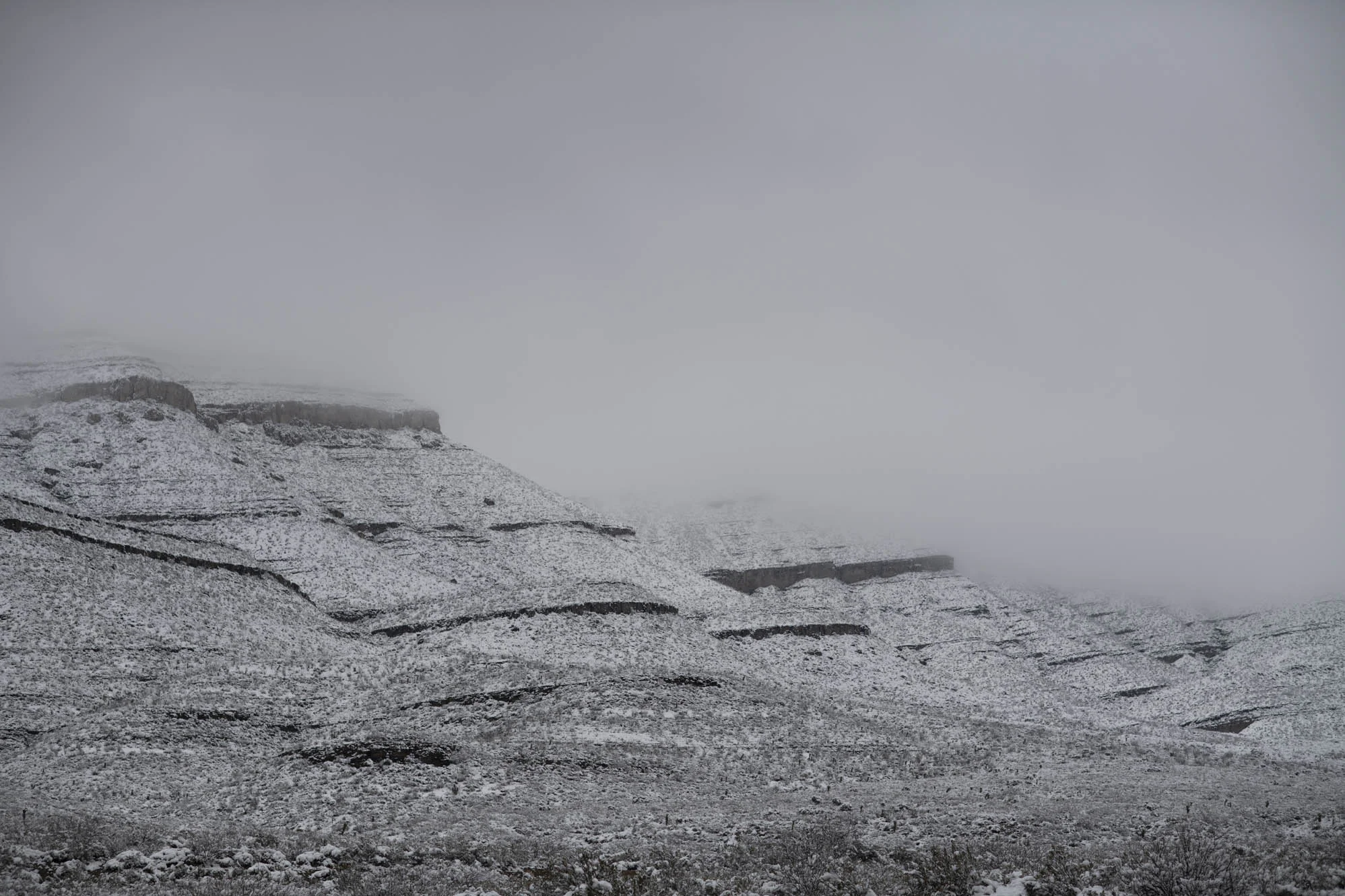 The mountains covered in snow.