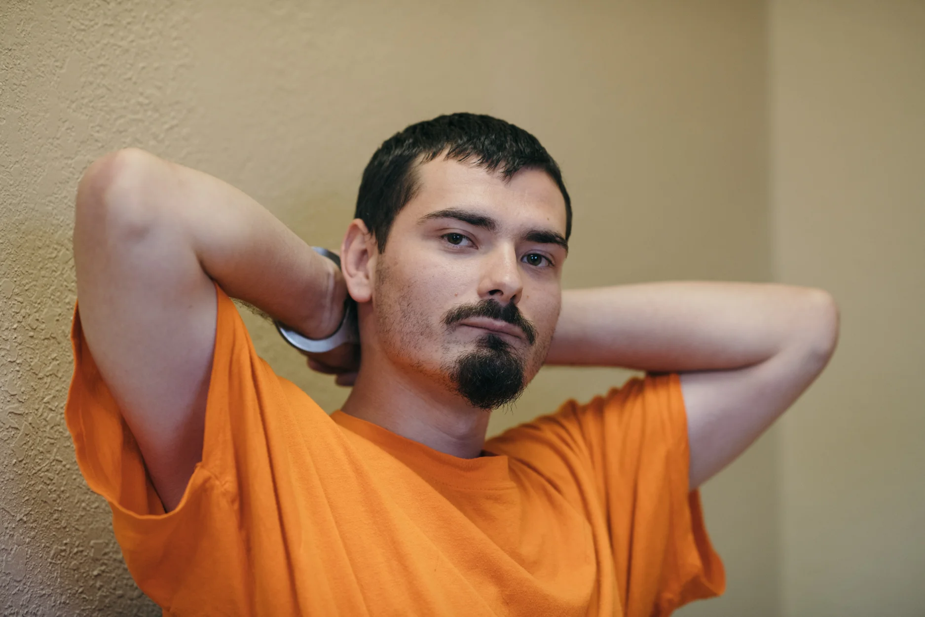 CJ sits in his case manager’s office at the Roswell Correctional Institution where he is serving his sentence for aggravated assault with a deadly weapon.