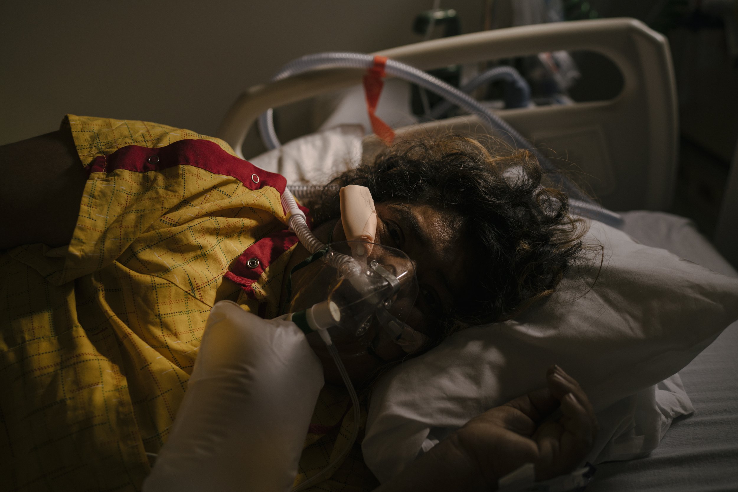  Edith Parredes lies in her bed in the telemetry section of the hospital. Ms. Parredes, 45, was hospitalized at M.L.K Jr. Community Hospital in South LA for Covid-19 for three months. She is a mother of four who has emigrated to the US from Mexico 21