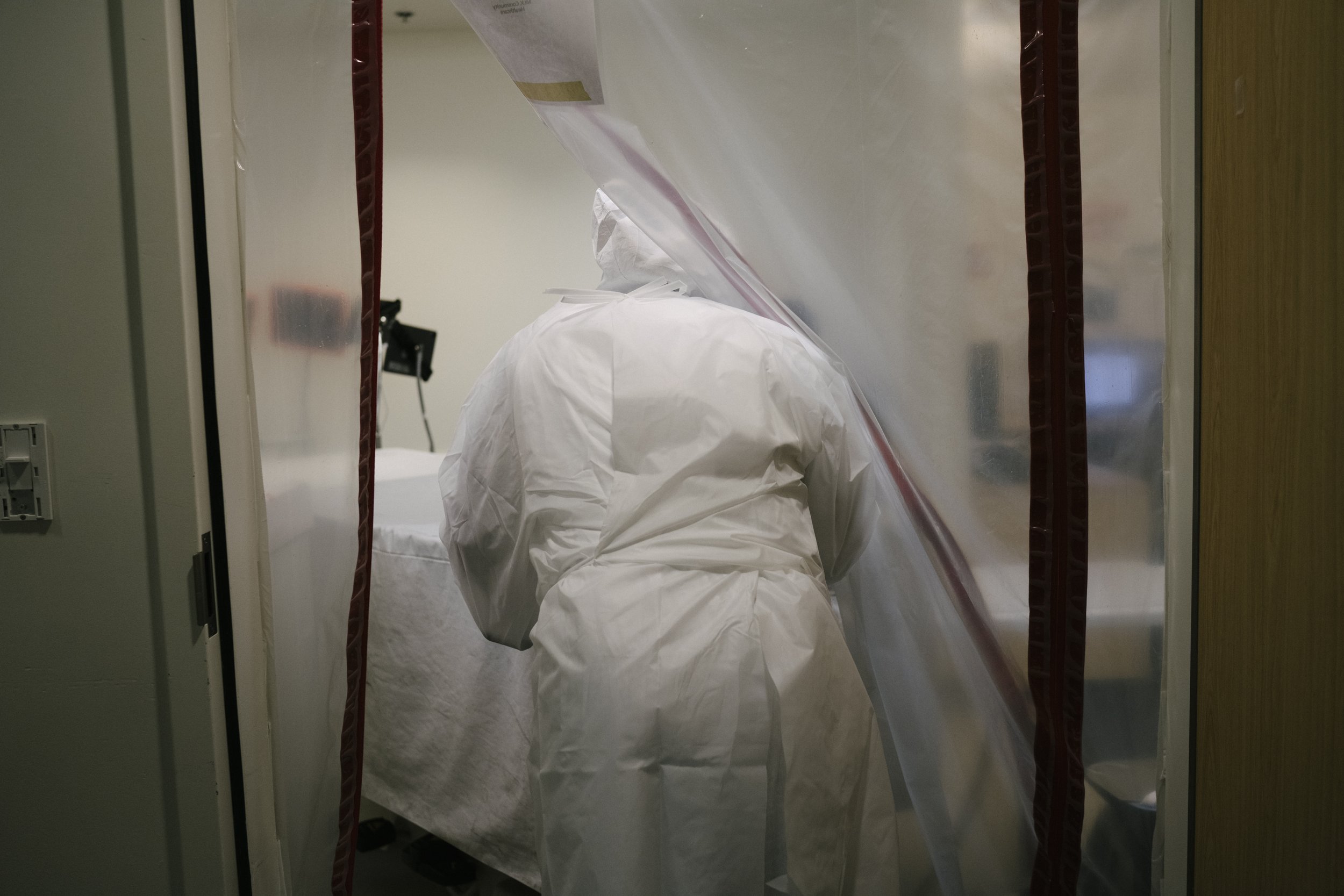  BJ Brown Jr, a member of the transport team, prepares to take a body of a patient with Covid-19 from the ICU to the hospital morgue at M.L.K Jr. Community Hospital in South Los Angeles, California. Mr. Brown has worked at the hospital since it opene