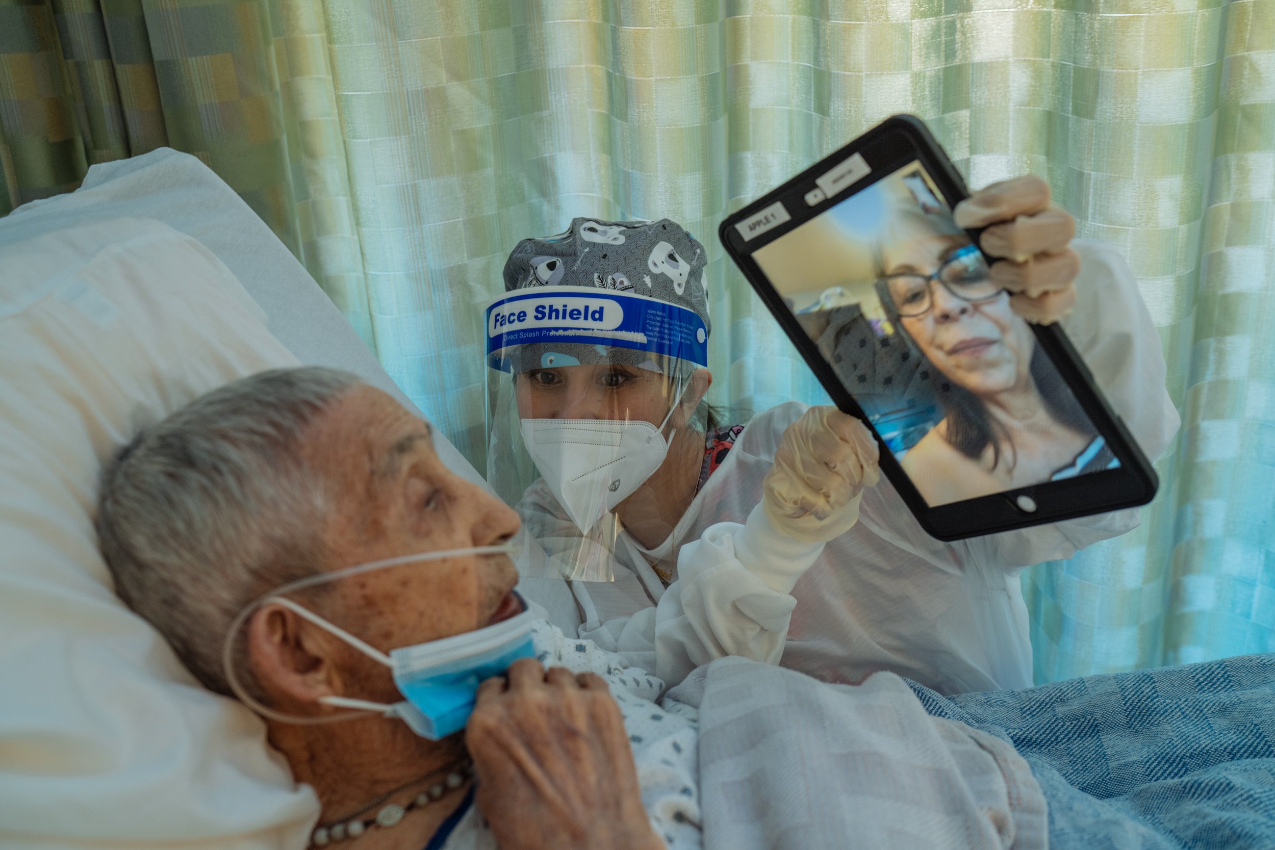  Maika Alvarez holds an iPad, as Jose Montoya interacts with his daughter, Lillie Ortiz, via Facetime. “It’s difficult for those of us family members. We are crushed by the helpless position we are in. We cannot hold our loved one’s hand and comfort 