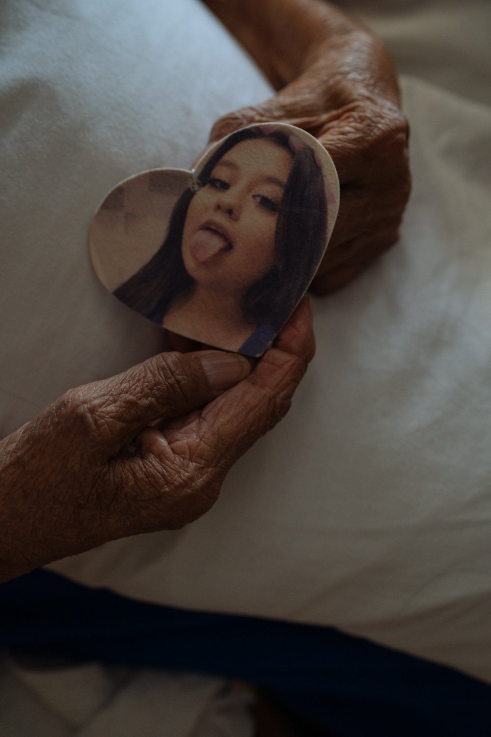  Alice Begay holds onto a photograph of her granddaughter.  