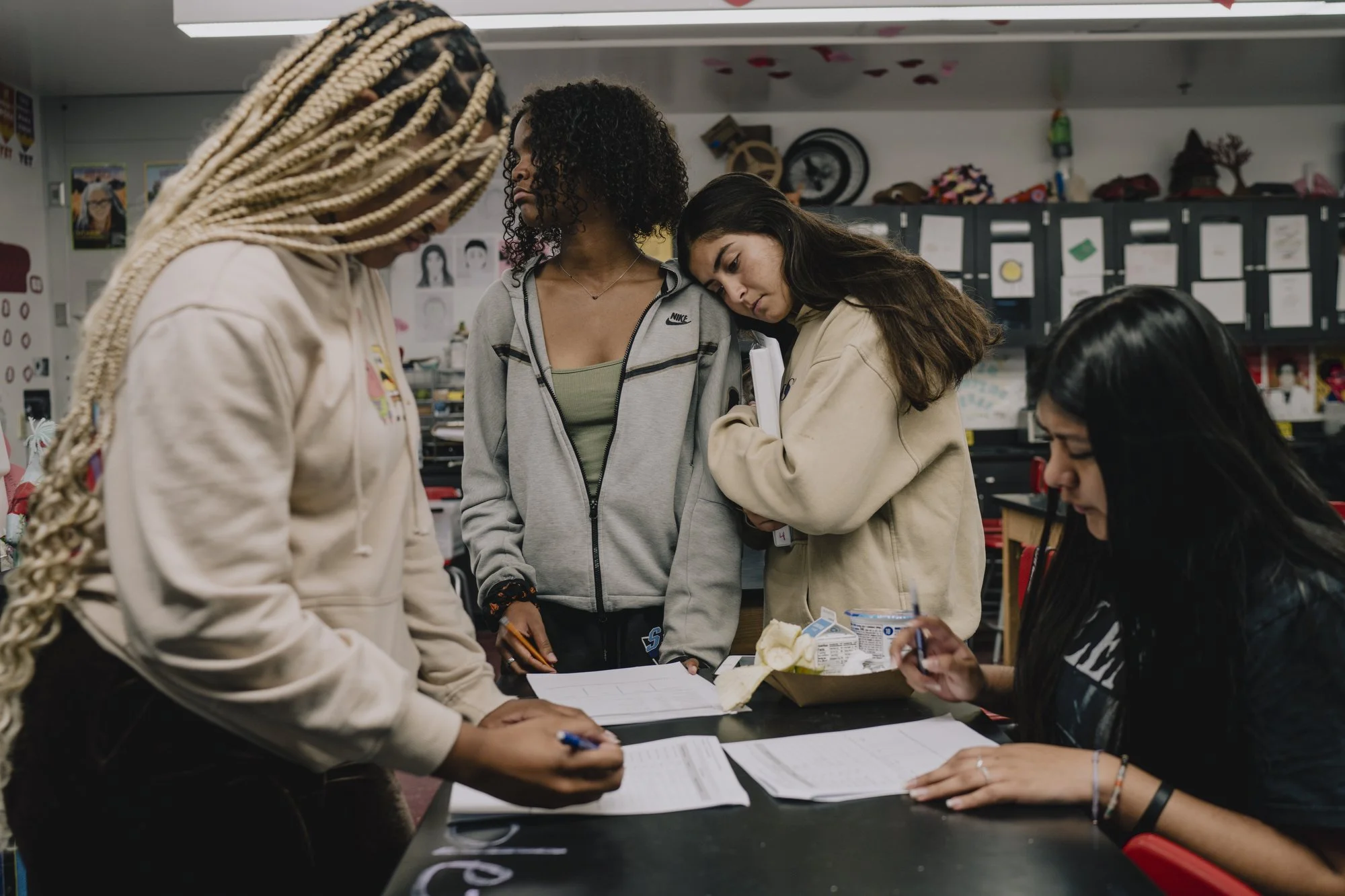  Tala and Semila, students in the 10th grade, lean on each other during Chemistry class, as Kaelin and Vanessa, who are also students in the 10th grade, complete a lab.  “I feel like I’ve known everyone for so long,” said Kaelin. “It feels like a fam