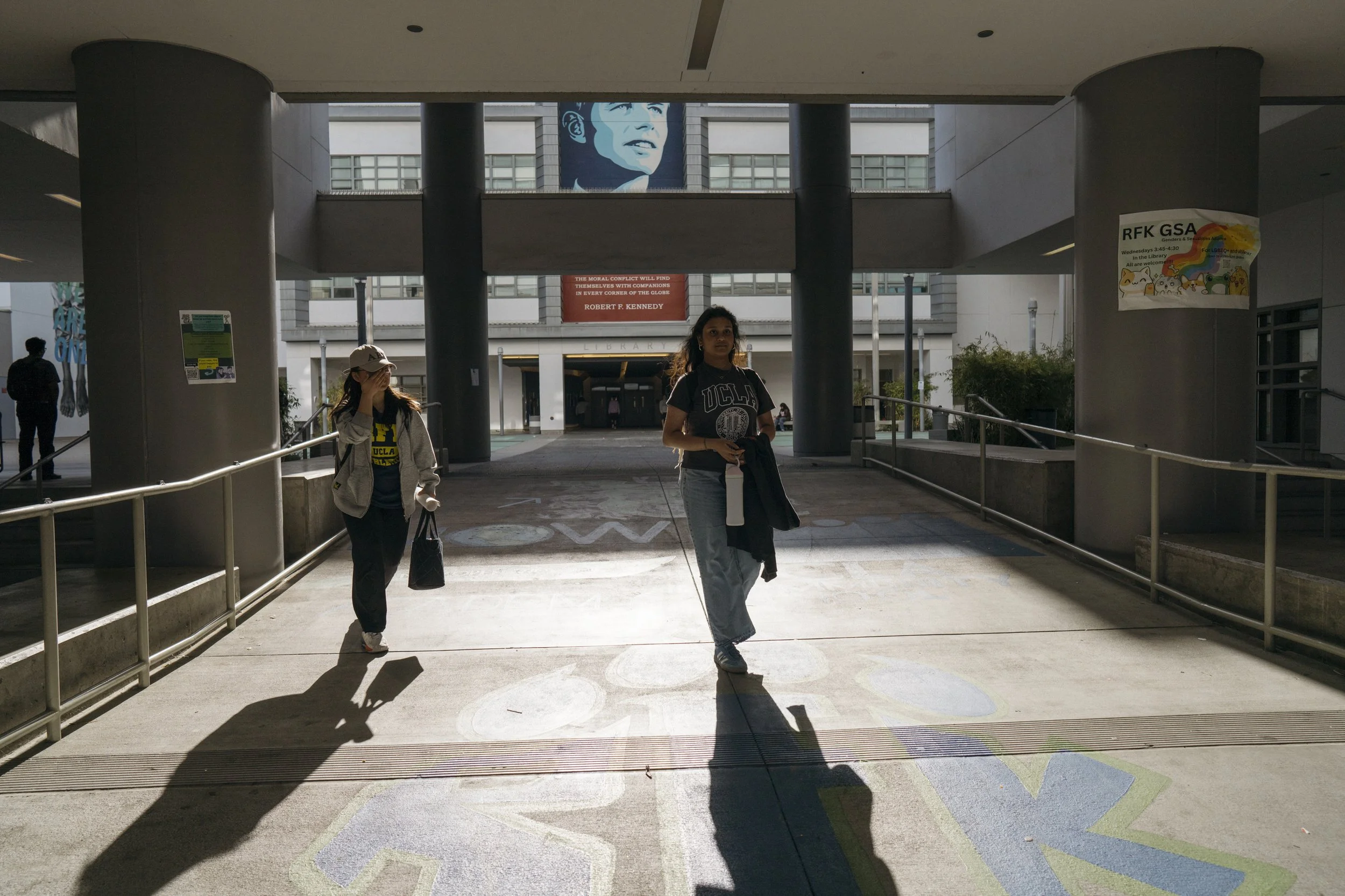  Sujana and a friend walk home from the RFK Community Schools Campus.  “The teachers have indoctrinated us to be empathetic to all people [since middle school],”  said Sujana. 