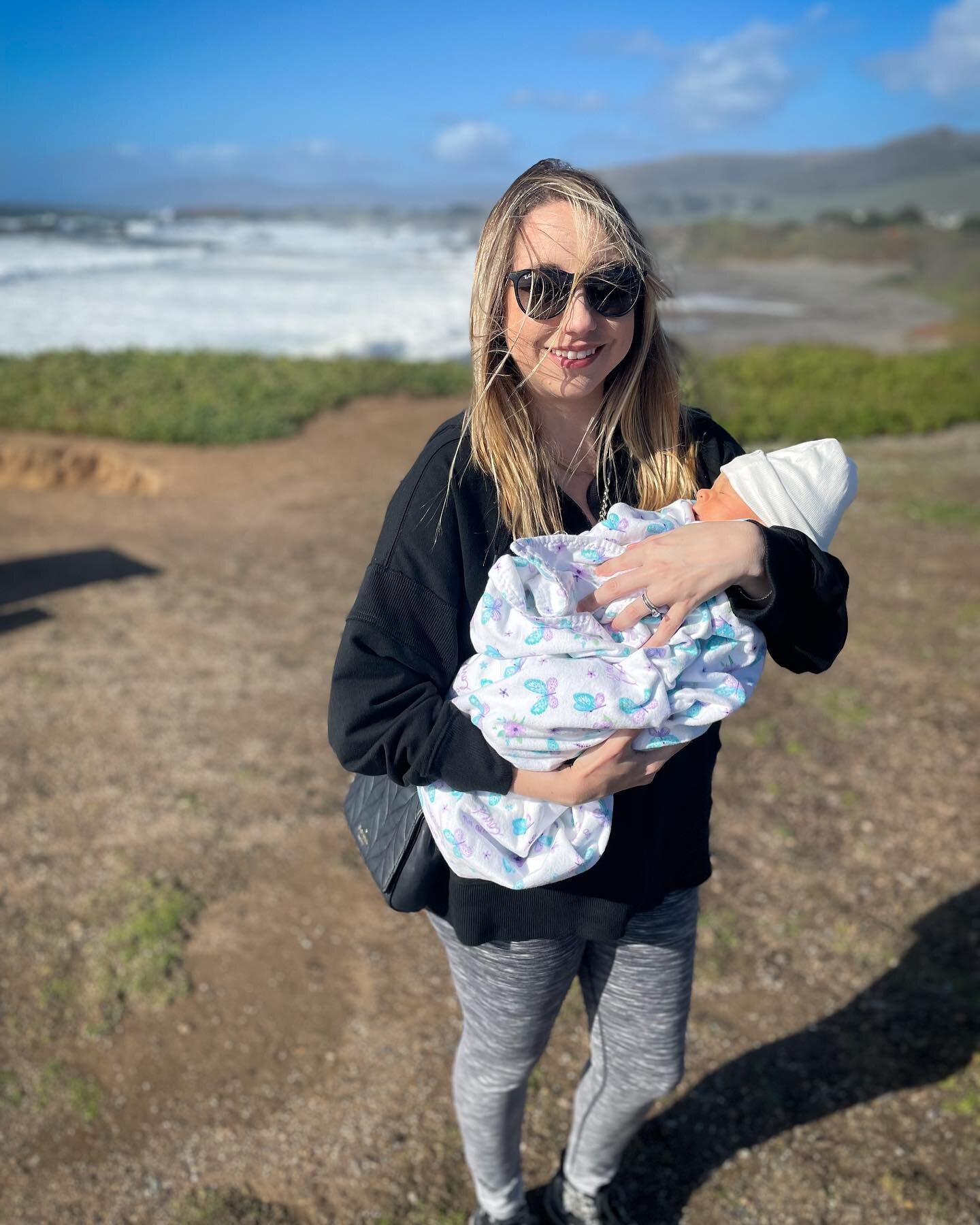 Olivia&rsquo;s first beach trip today - our favorite place. Only lasted about 2.5 seconds due to the wind, but it was a nice quick outing for mama and papa 🌊☀️🦋