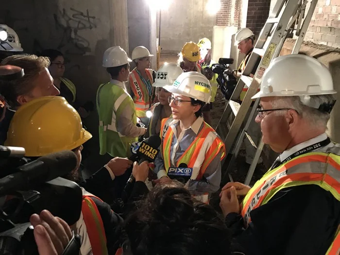 NYC DOT Commissioner Polly Trottenberg, center, and Robert Collyer, DOT Deputy Commissioner of Bridges, right, speak to reporters about the upcoming Brooklyn-Queens Expressway rebuild. They are standing in the interior of the BQE under the Brooklyn Heights Promenade, which would be temporarily demolished under DOT’s preferred plan. // Eagle photos by Mary Frost