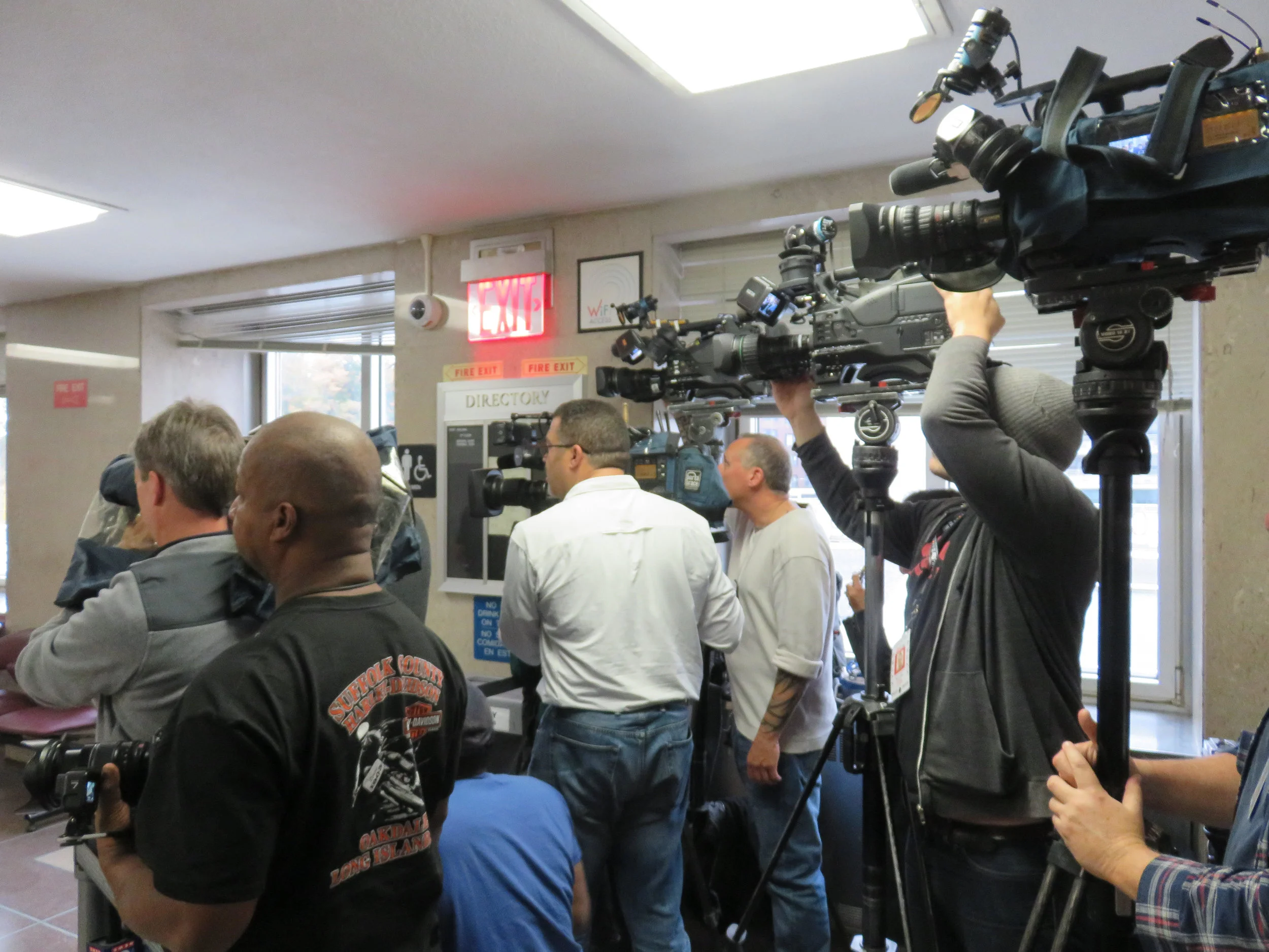 Members of the media staked out spots on the third floor of the Queens Criminal Courthouse Monday. Eagle photo.