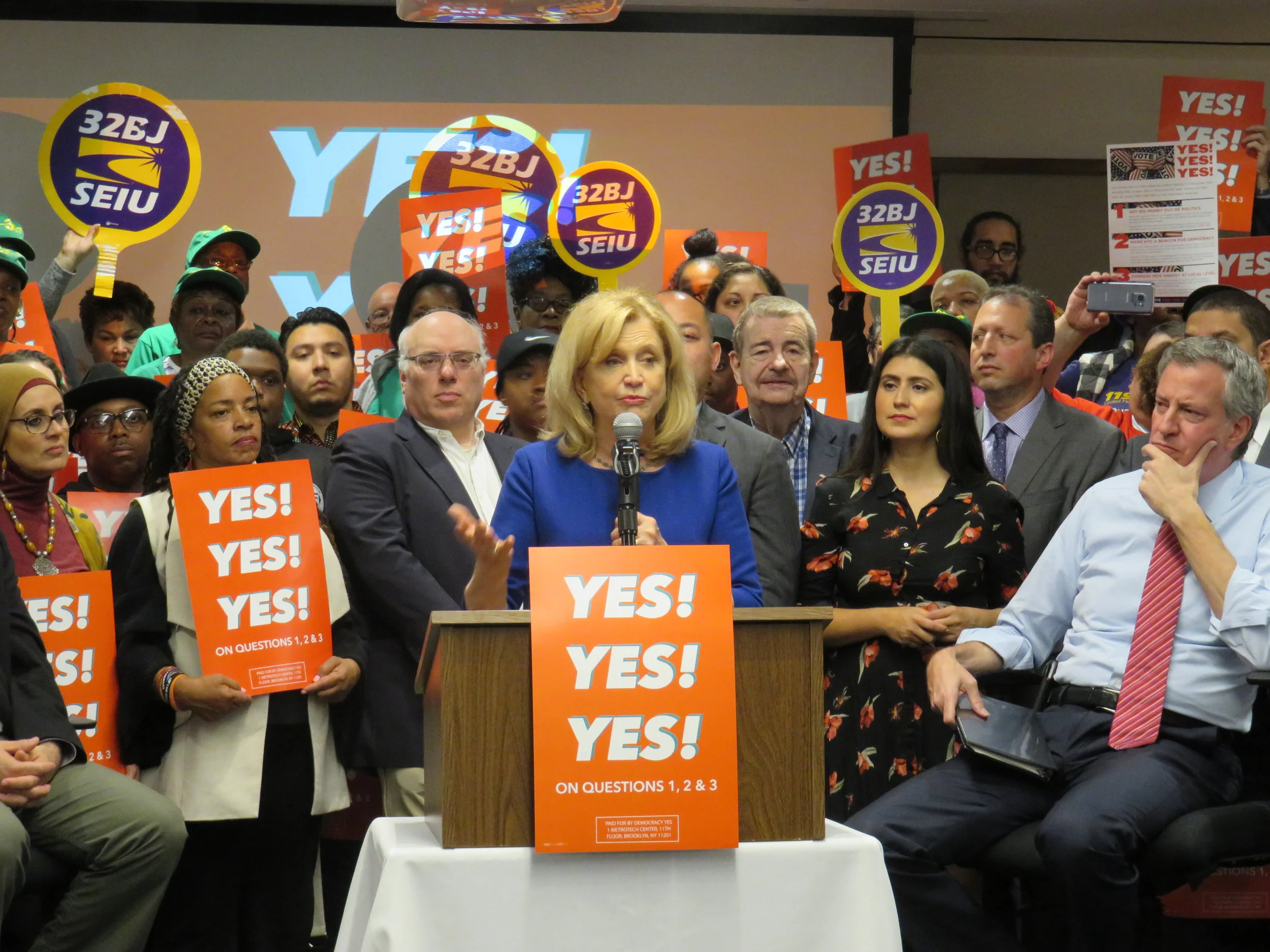 U.S. Rep. Carolyn Maloney, who represents Western Queens, urged voters to support three charter revision ballot proposals at a rally last Thursday. All three ballot proposals passed overwhelmingly. Eagle photo by David Brand.
