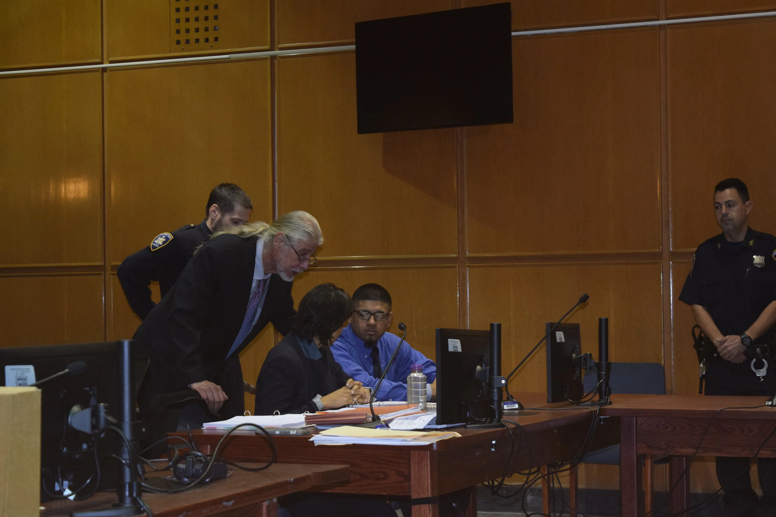 From left to right: Defense attorneys Ron Kuby, Rhiya Trivedi with their client Prakash Churaman. Eagle photo by Christina Carrega.