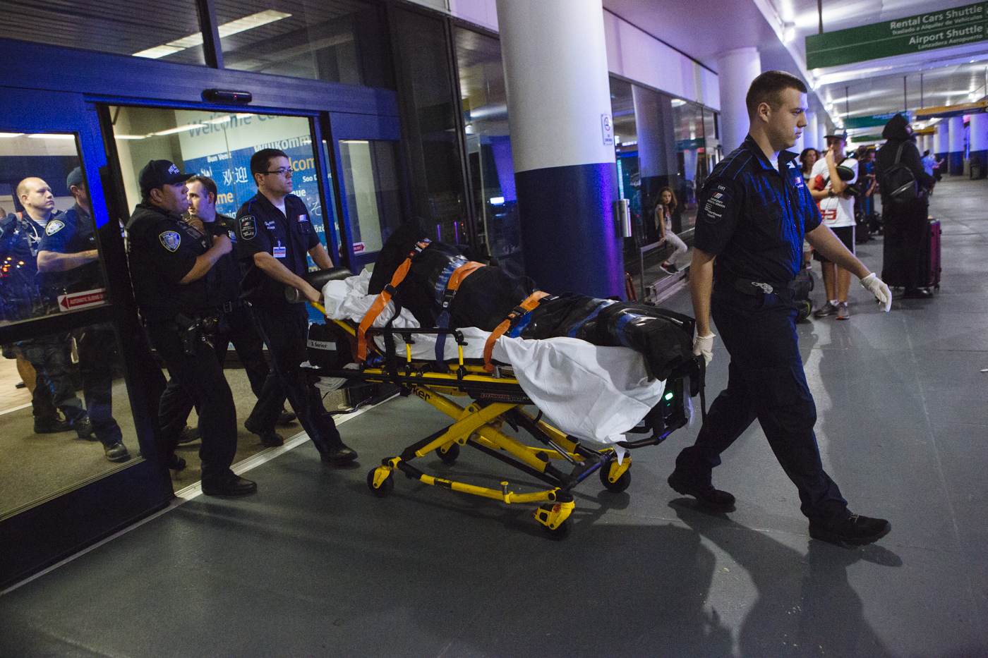 Photographer Angus Mordant was charged with loitering after he took photographs of a police action in the entrance to LaGuardia Airport Terminal D in September. He appeared in Queens Criminal Court Tuesday. Photos courtesy of Angus Mordant