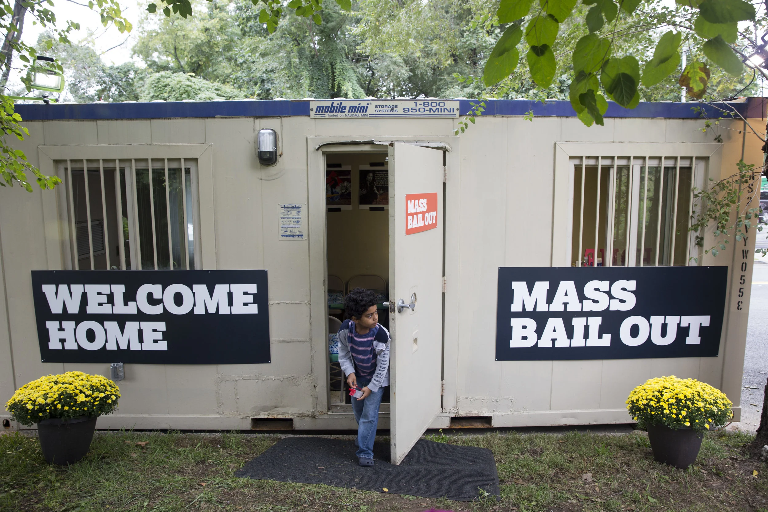 A child exits the Mass Bail Out Project Welcome Center outside the entrance to Rikers Island. // Eagle file photo by Clarissa Sosin