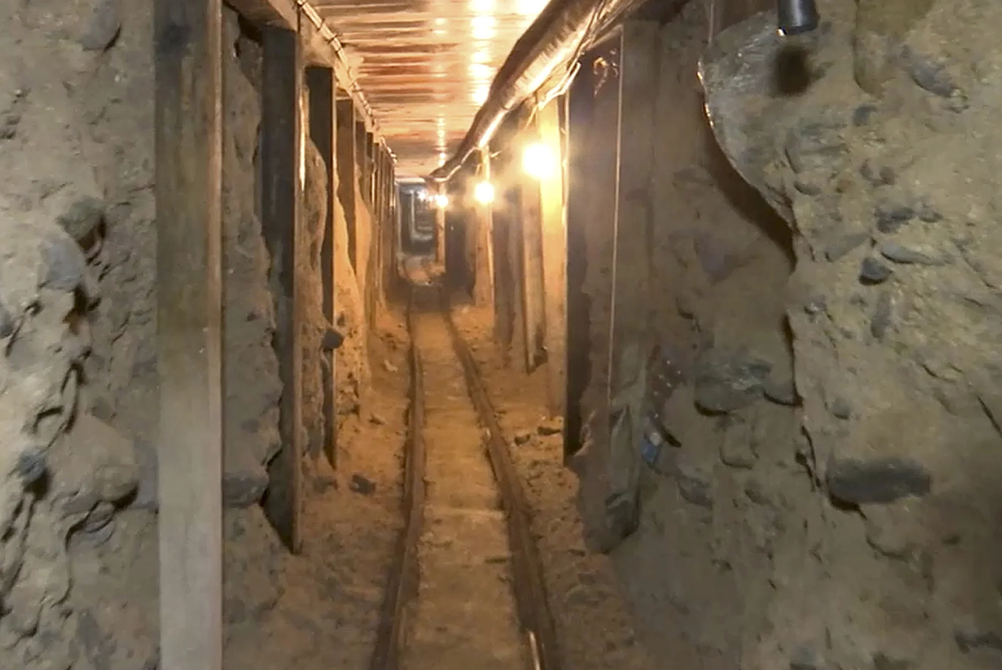 This frame grab taken from a Dec. 12, 2016 video provided by the Mexican Attorney General's Office, or PGR, shows one of two tunnels found in an area of warehouses in the border city of Tijuana that lead into California. Mexico's Attorney General's Office via AP.