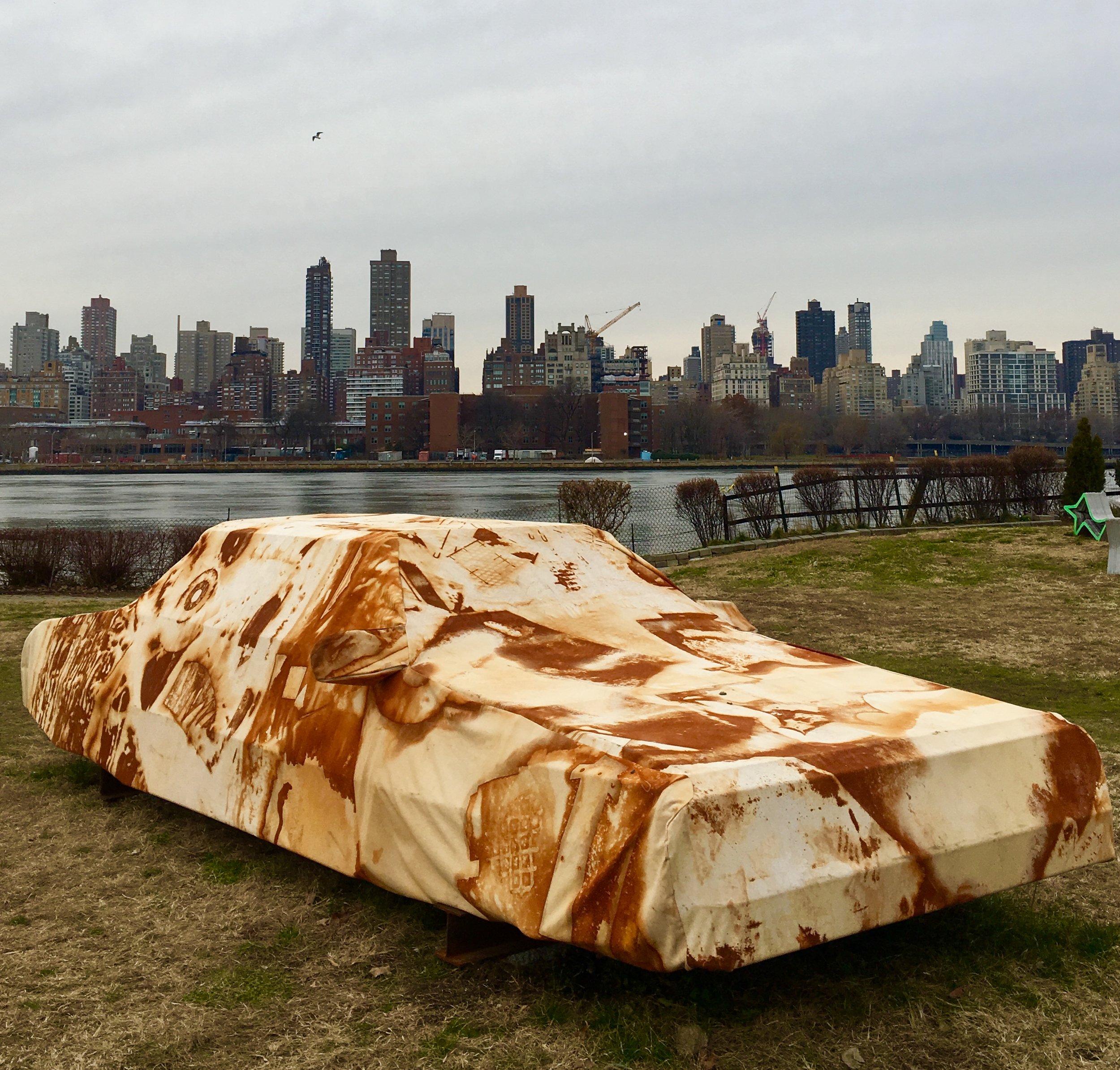 Park on Long Island City's waterfront. “Into the ground,” the eye-catching sculpture in the foreground, is by artists Joe Riley and Audrey Snyder.
