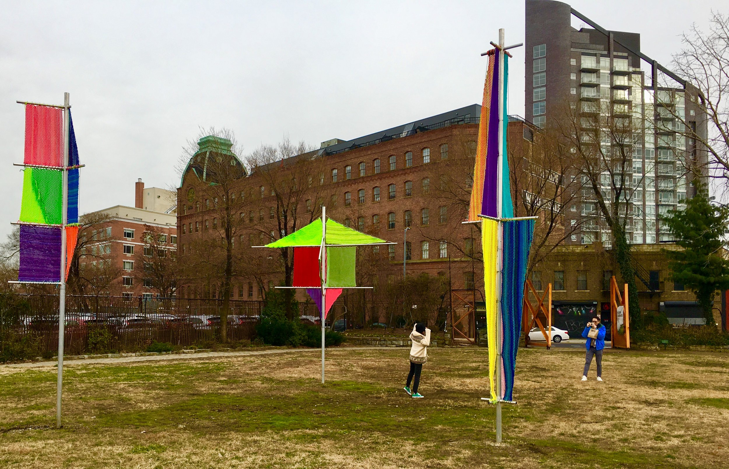  A Socrates Sculpture Park visitor poses for a picture beside Jesse Harrod&amp;#39;s work “Flagging 1, 2, 3.” 