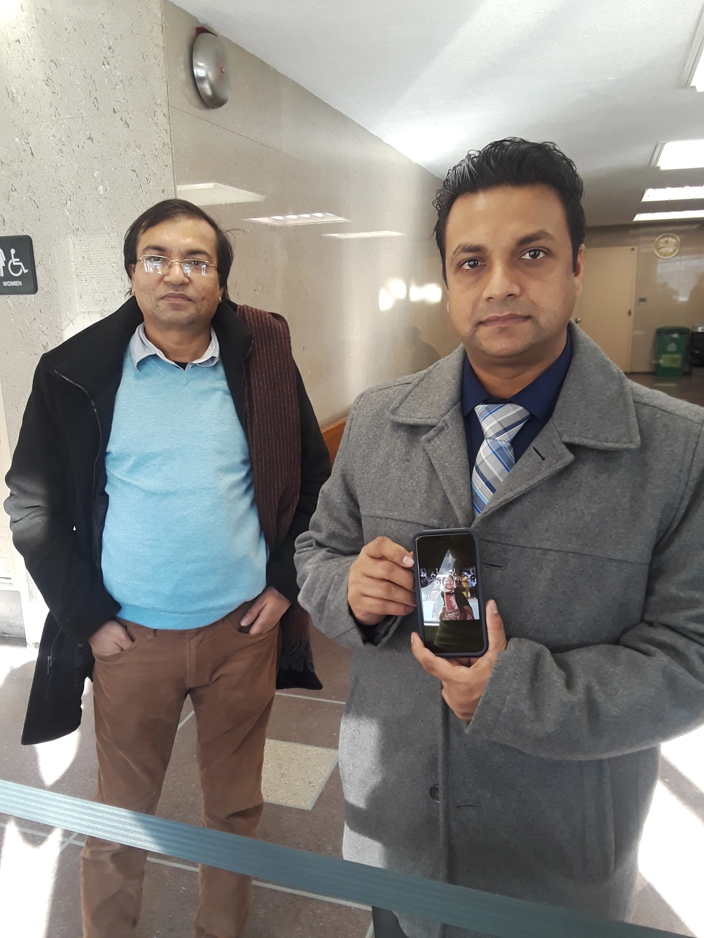 NYPD Officer Humayun Kabir holds a picture of his aunt Nazma Khanam who was stabbed to death by Yonathan Galvez-Marin in 2016. Eagle photo by Christina Carrega.