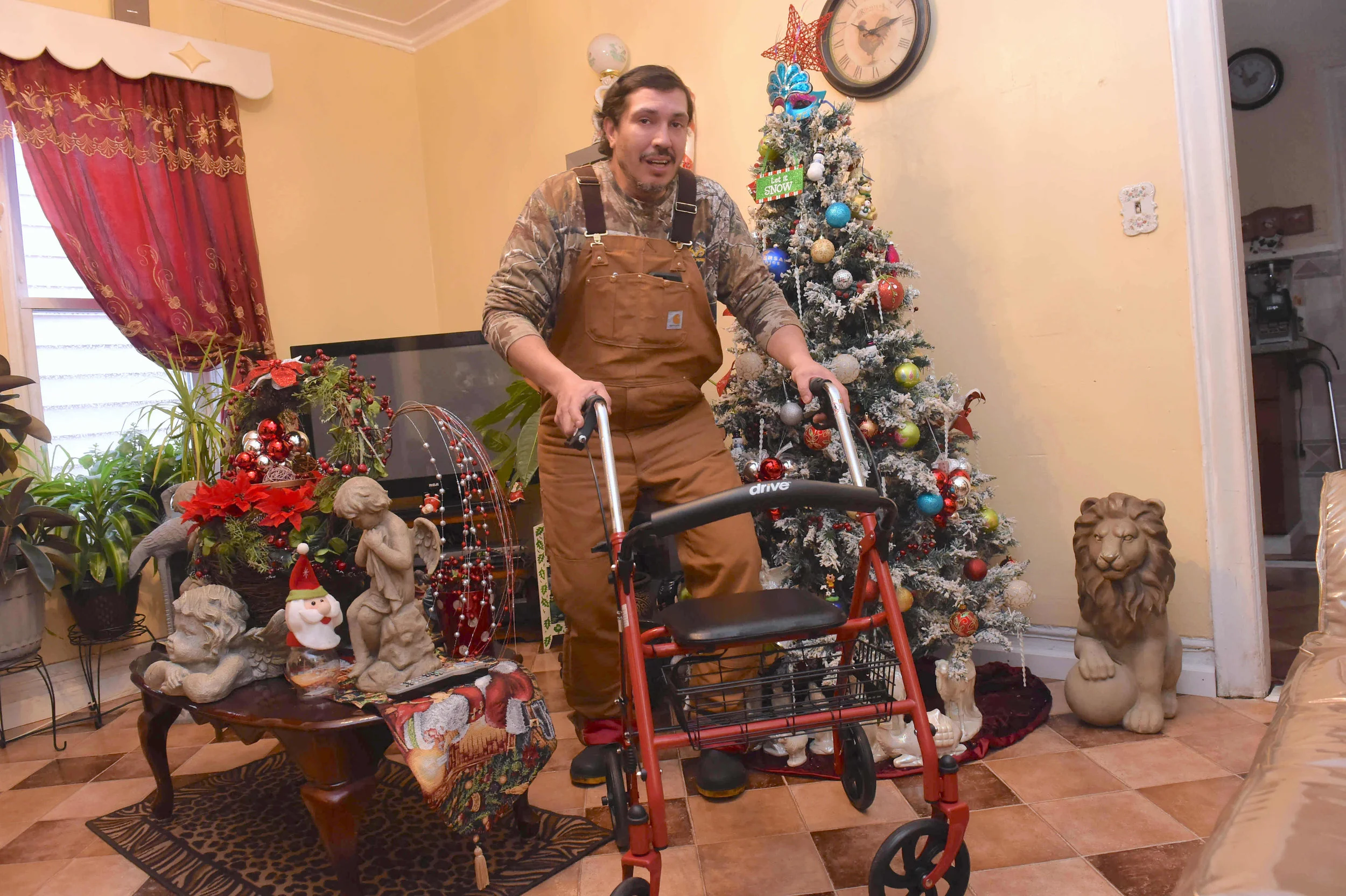 Ramon Lopez in his home. Eagle PHoto by todd maisel