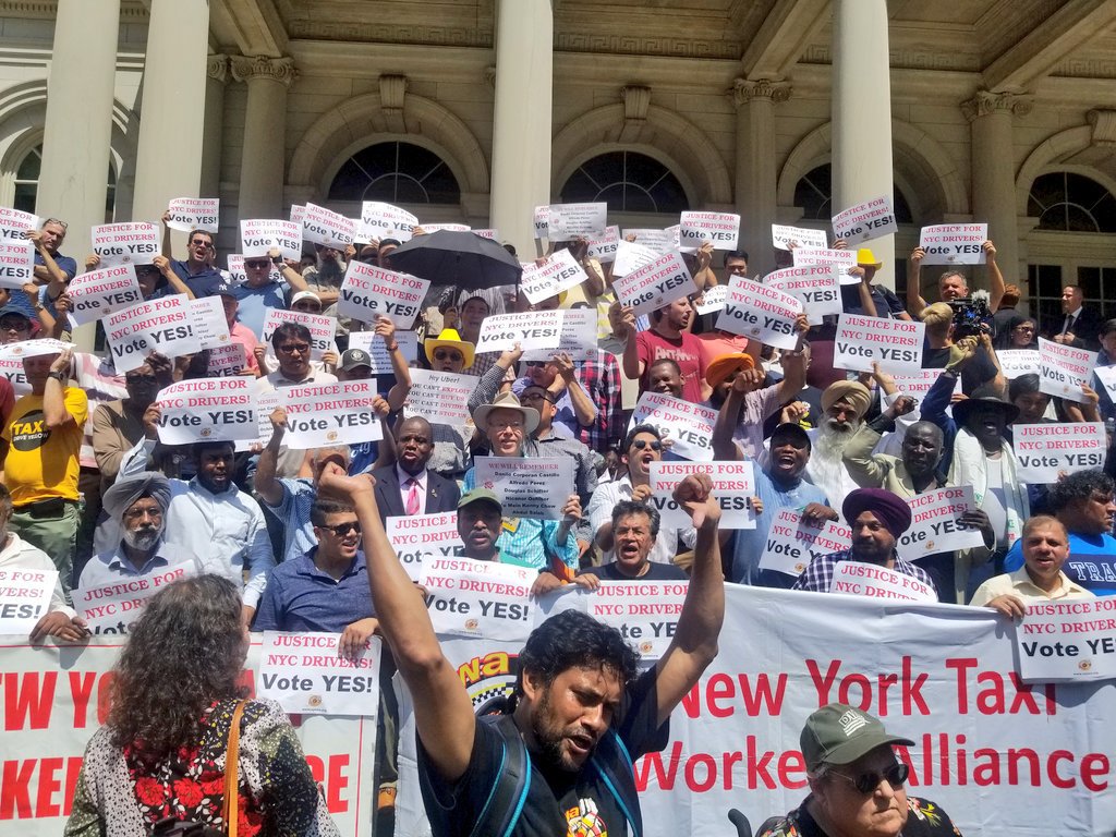 Members of the New York Taxi Workers Alliance demonstrate outside New York City Hall. Photo by Nick Gulotta via Law at the Margins.
