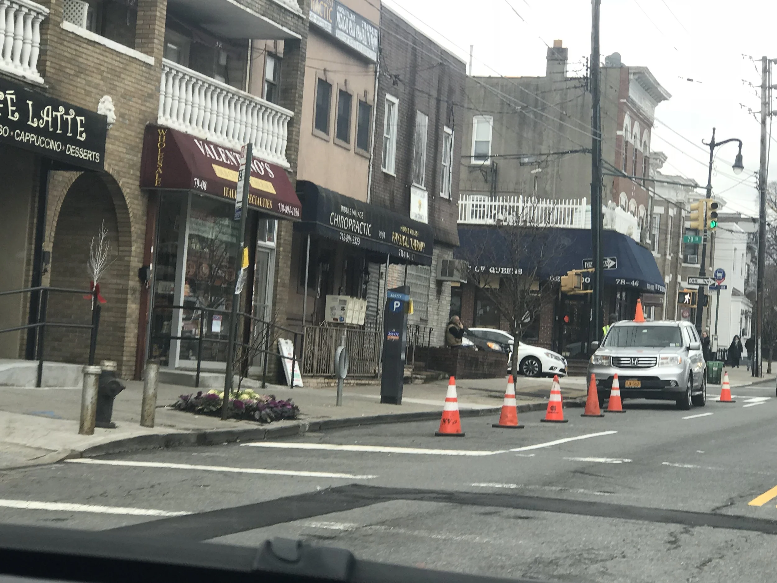 A film production crew reserves coveted parking spots along Metropolitan Avenue in Maspeth. Photo courtesy of Robert Holden’s office.