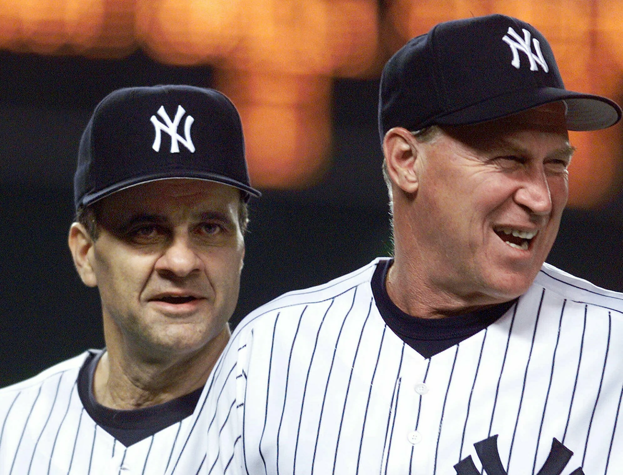 New York Yankees manager Joe Torre (left) and pitching coach Mel Stottlemyre head onto the field to congratulate their players after the Yankees defeated the Seattle Mariners 8-0 in New York in April 1999. Stottlemyre and Torre both coached in the Mets organization. The Yankees said Stottlemyre died Sunday, Jan. 13, 2019. AP Photo/Mark Lennihan, File