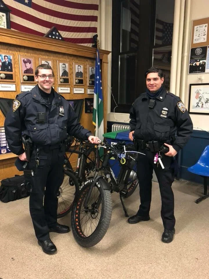 Officers from the 10th Precinct in Manhattan stand with seized e-bikes. Twitter photo via 10th Precinct