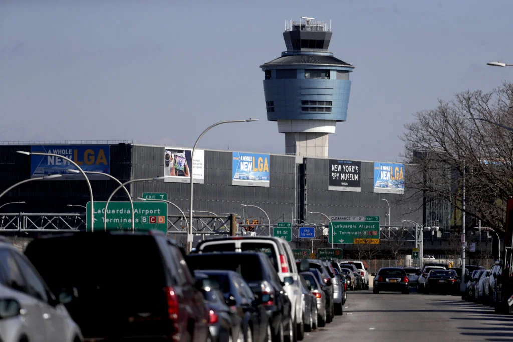 The air traffic control tower at LaGuardia Airport is pictured here on Friday. The Federal Aviation Administration reported delays in air travel Friday because of a "slight increase in sick leave" at two East Coast air traffic control facilities. AP Photo/Julio Cortez.