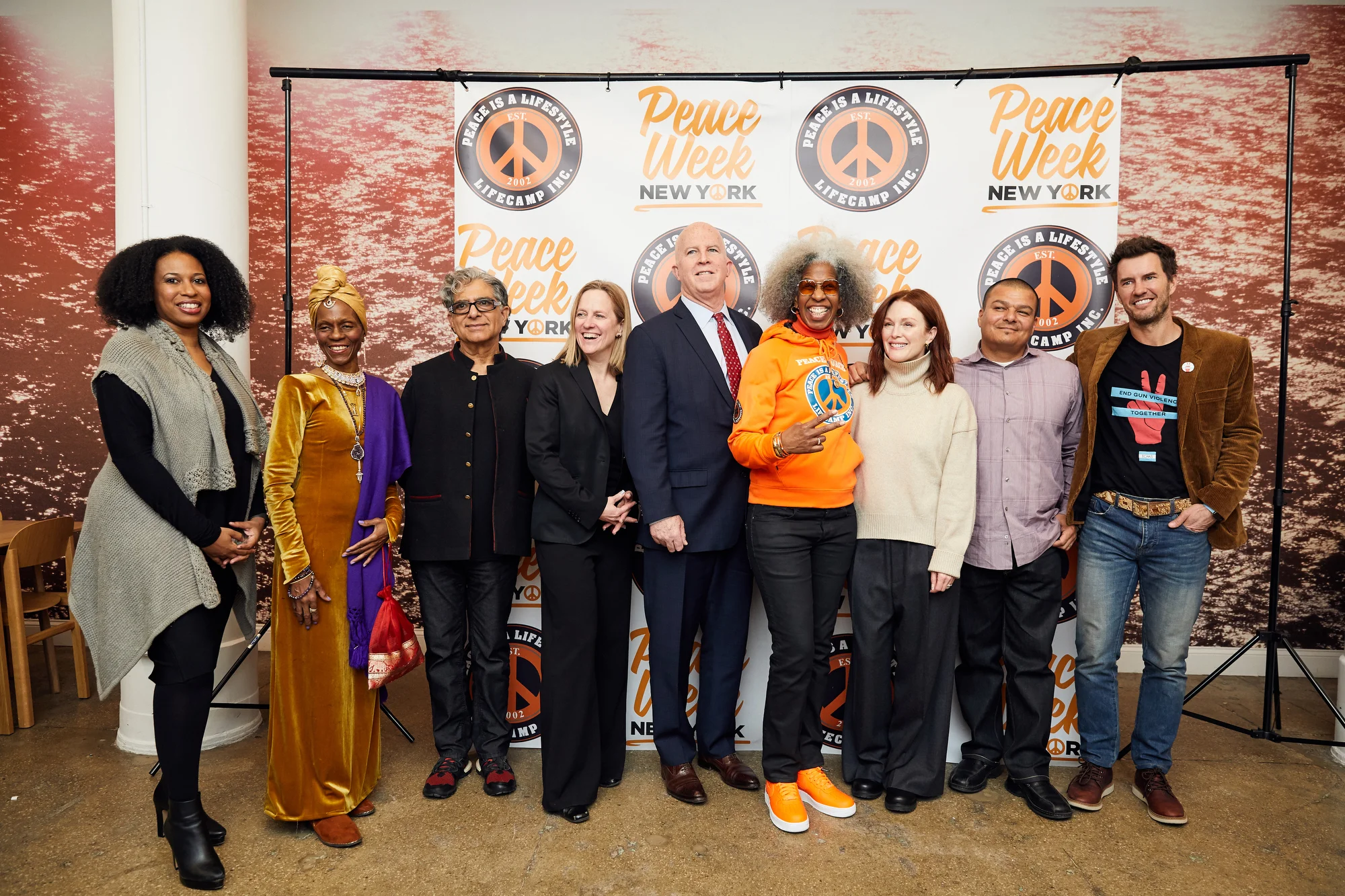 From left, Dr. Aletha Maybank, deputy commissioner of the New York City Department of Health and Mental Hygiene; wellness practitioner Queen Afua; best-selling author Deepak Chopra, Borough President Melinda Katz; NYPD Commissioner James O’Neill; Erica Ford of LIFE Camp, Inc; Academy Award-winning actress Julianne Moore; Hector Verdugo, the associate executive director at HomeBoy Industries and co-chair of the National Black & Brown Gun Violence Prevention Consortium; and Blake Mycoskie, CEO of TOMS Shoes. Photo courtesy of Borough Hall.