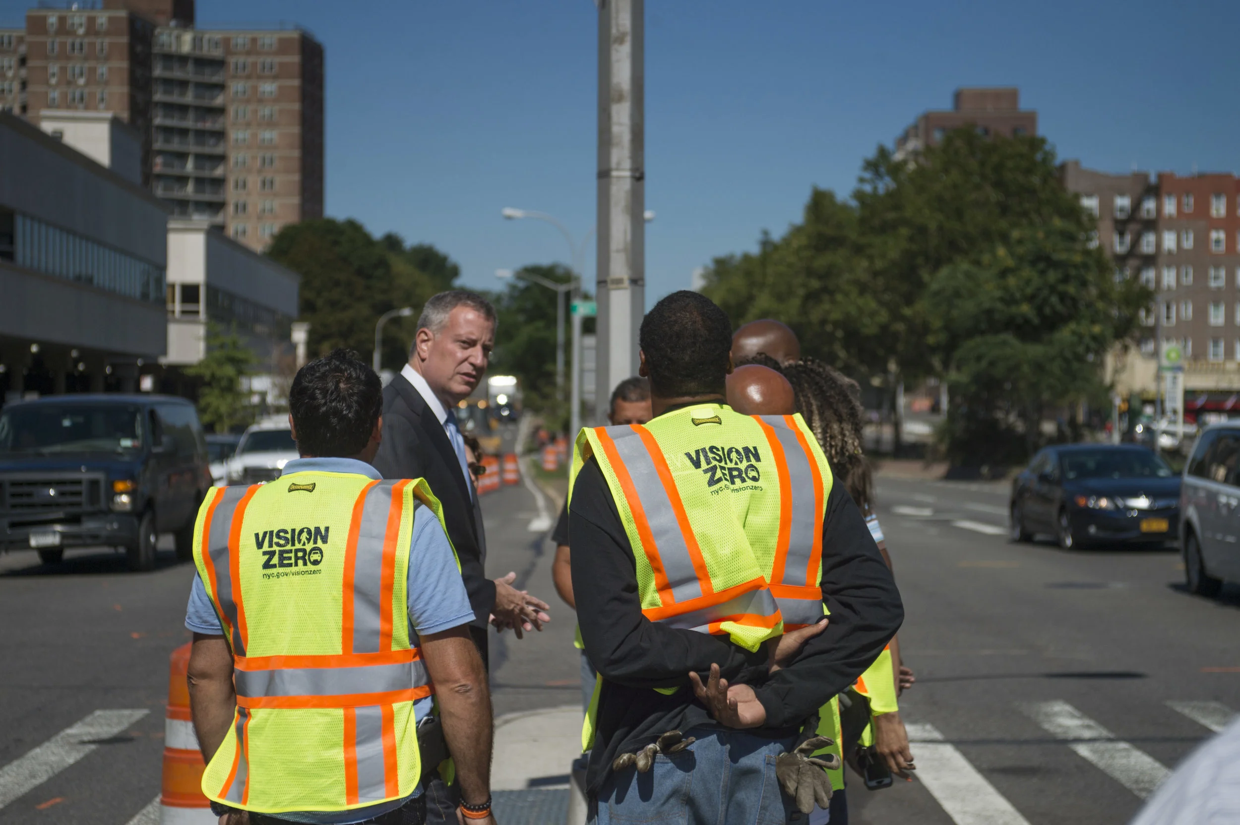 Mayor Bill de Blasio stands at 61st Street and Queens Boulevard after announcing the start of a $100 million Vision Zero project to redesign Queens Boulevard. So far this year, pedestrian deaths and injuries have increased in Queens. Ed Reed/Mayoral Photography Office.