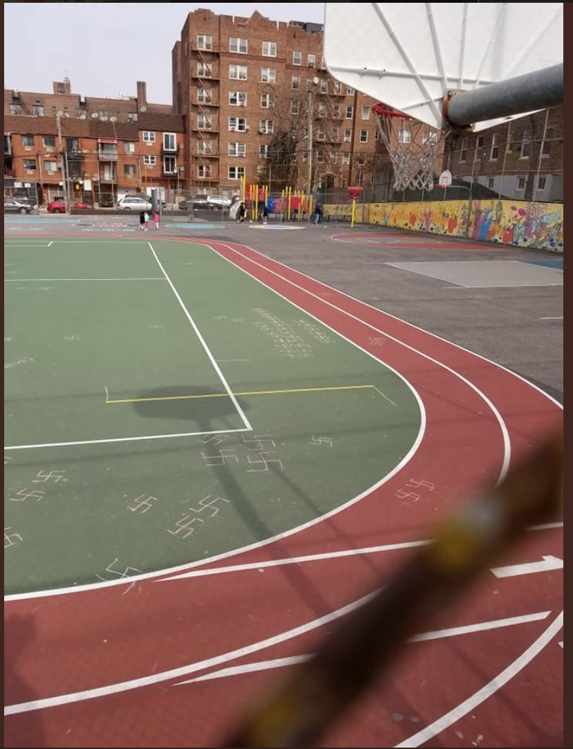 Swastikas cover the schoolyard at PS 139 in Rego Park. Photo via Councilmember Karen Koslowitz/Twitter