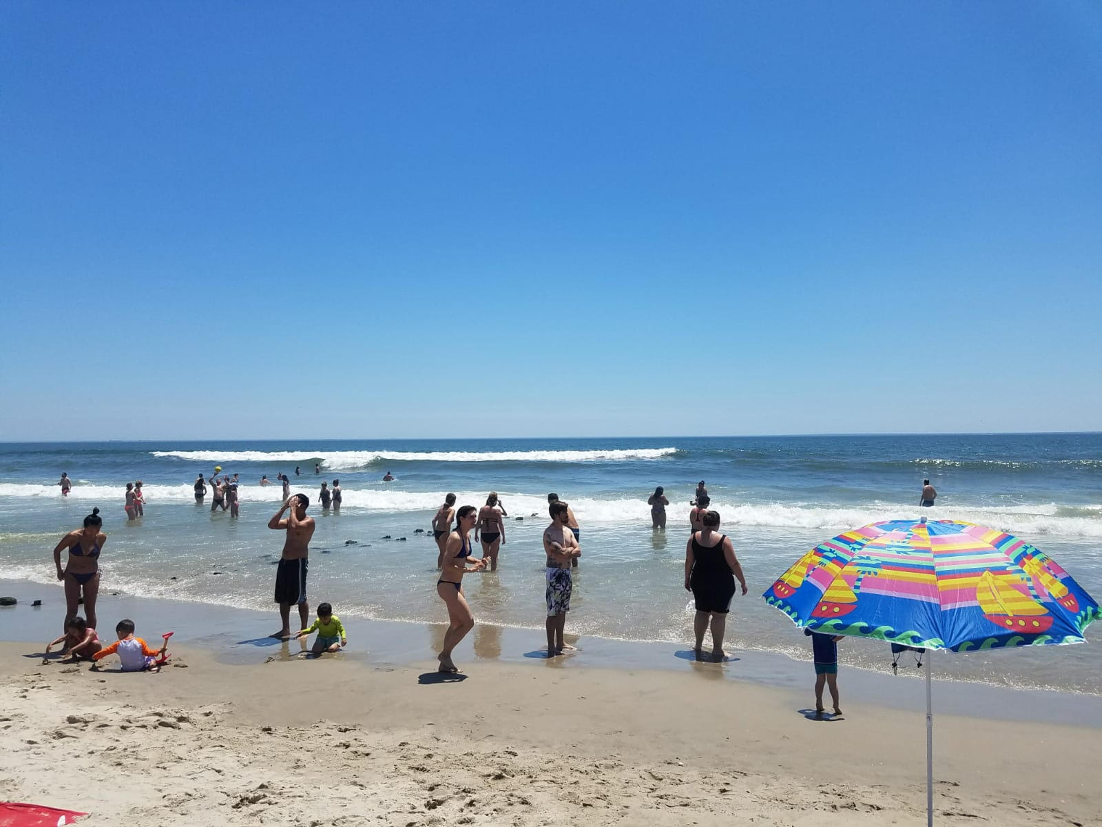 Swimmers and sunbathers pack Rockaway Beach. Photo by Zach Hoffman.