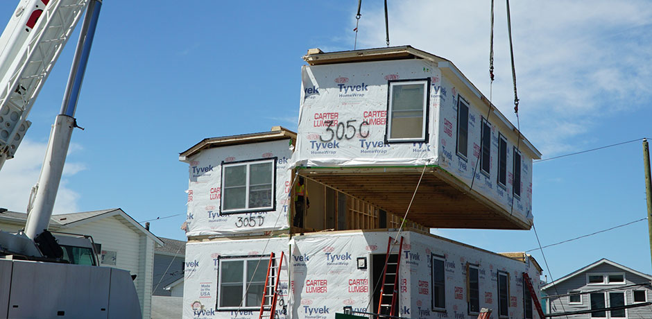 Final section of a Build It Back modular home lowered into place in Broad Channel. Photo via NYC.gov.