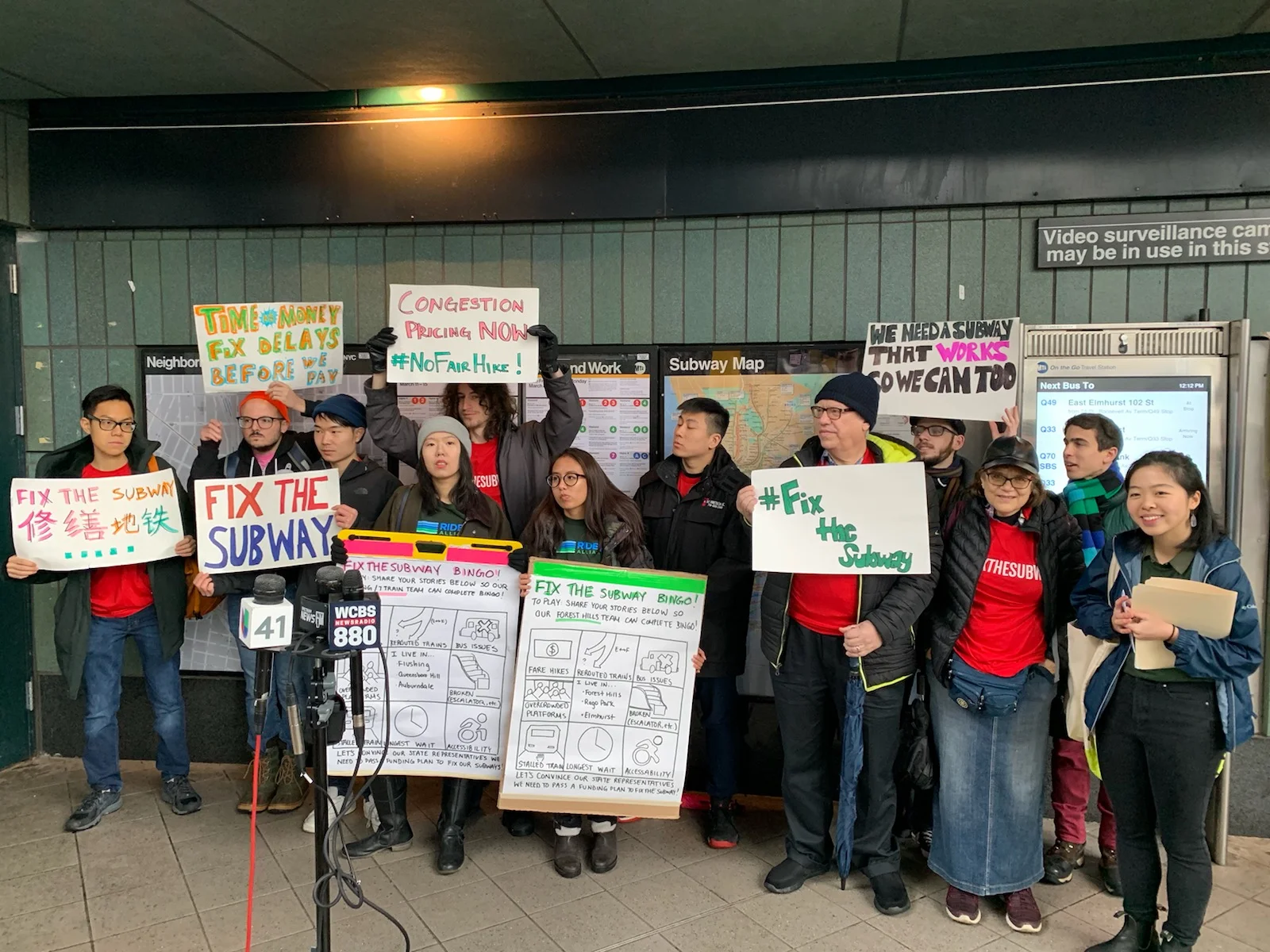 Commuters from Riders Alliance rally in support of congestion pricing at "#FixTheSubway BINGO" in Jackson Heights on March 10. Photos courtesy of Riders Alliance.