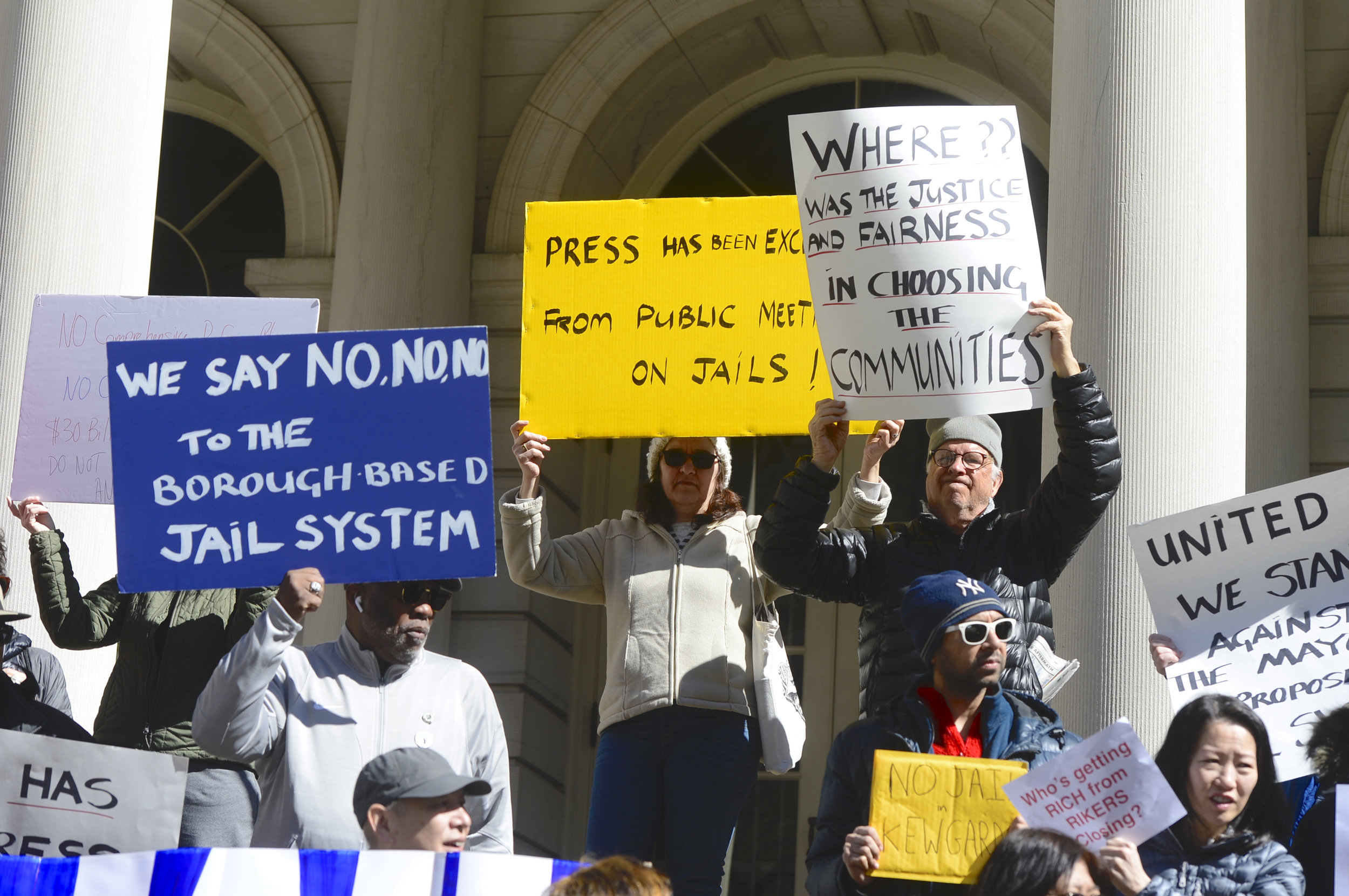  Demonstrators oppose the plan for a new jail in Kew Gardens at a City Hall rally on Sunday.  Eagle  photos by Todd Maisel.    