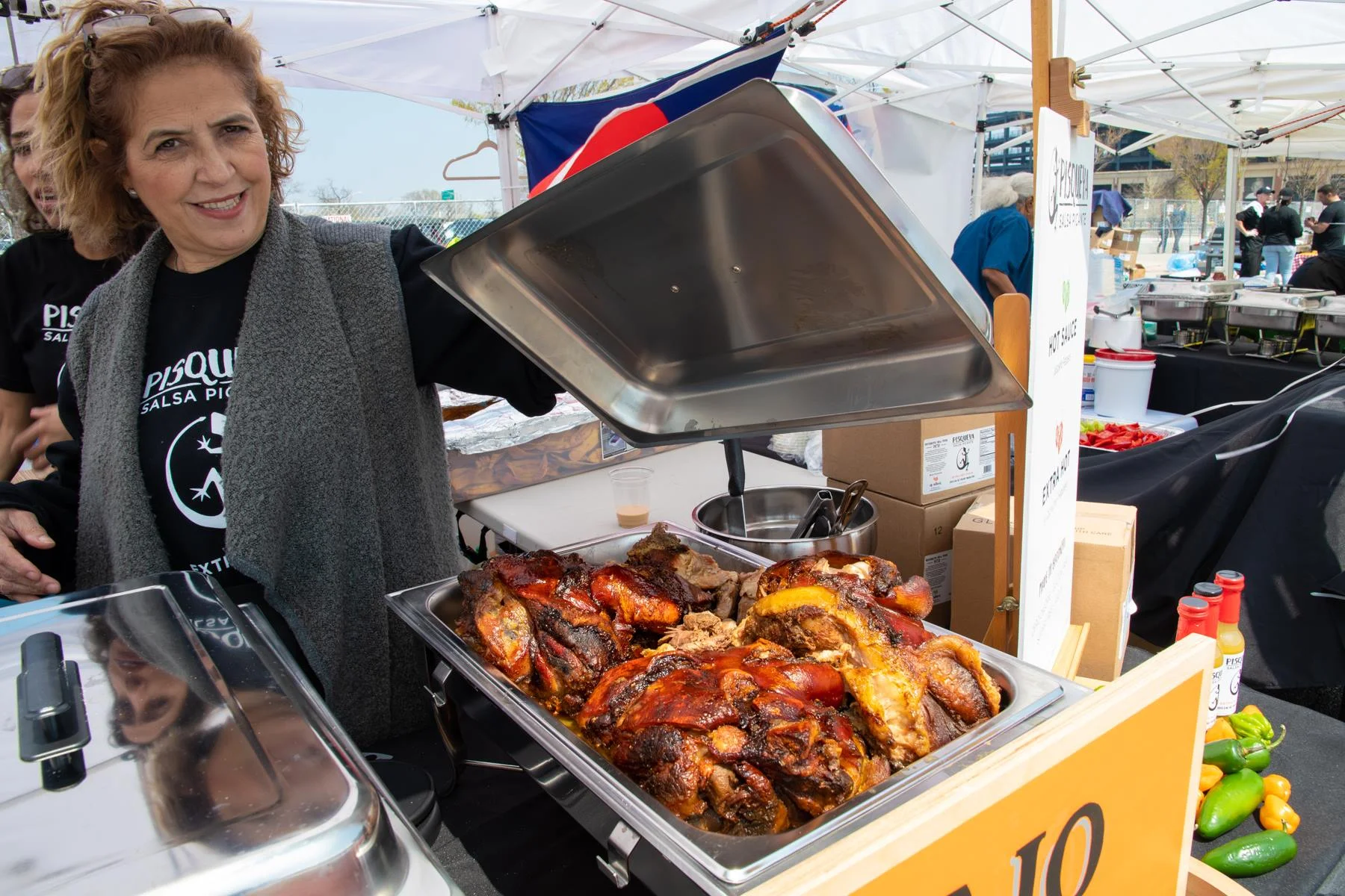 a world’s fare vendor reveals pernil. photo via the world’s fare