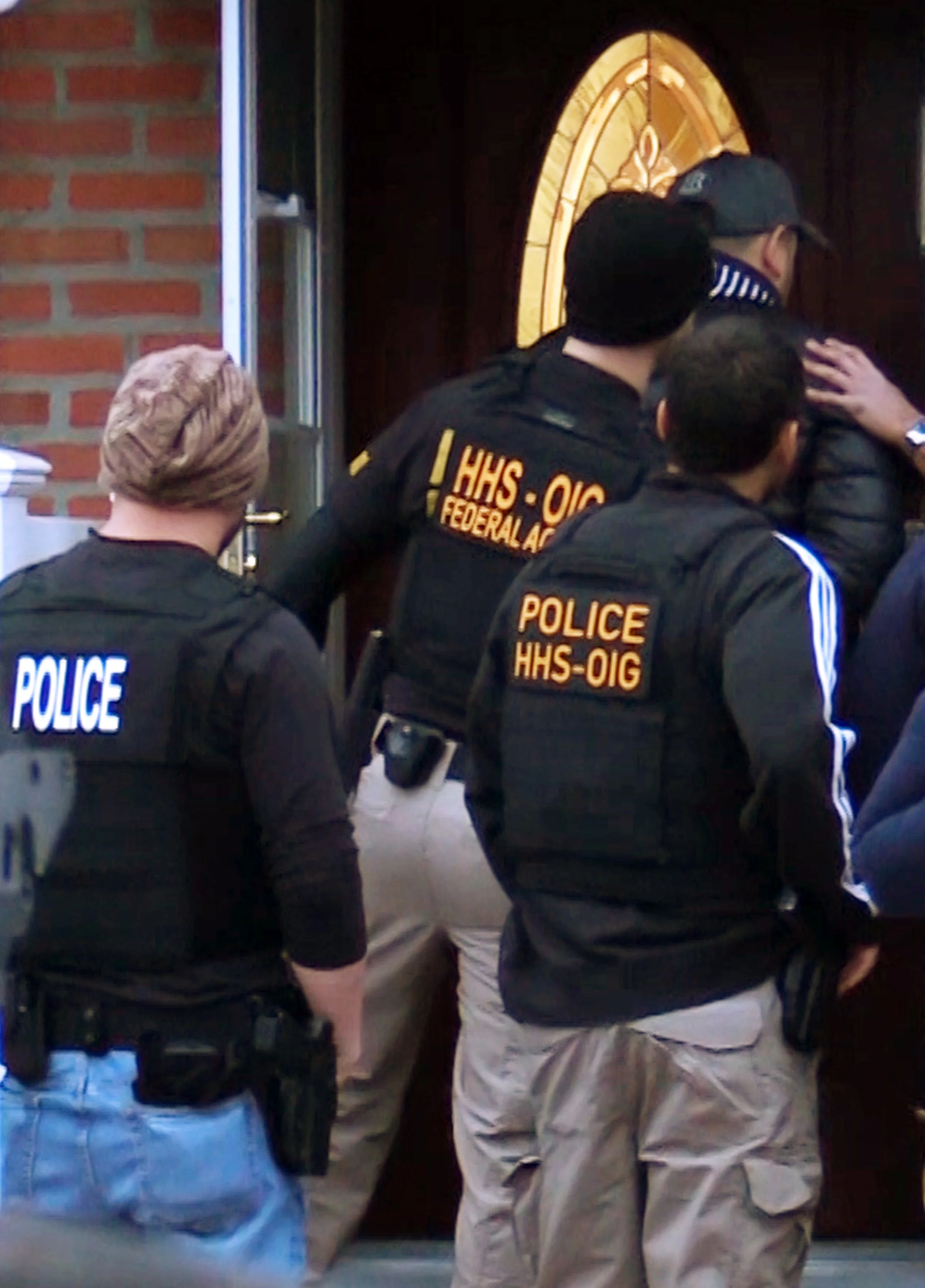 In this photo provided by the Department of Health and Human Services, Office of Inspector General, HHS Office of Inspector General agents, take part in arrests Tuesday in Queens as they break up a billion-dollar Medicare scam that peddled unneeded orthopedic braces to hundreds of thousands of seniors nationwide, using a network of foreign call centers. Photo by Department of Health and Human Services, Office of Inspector General via AP.