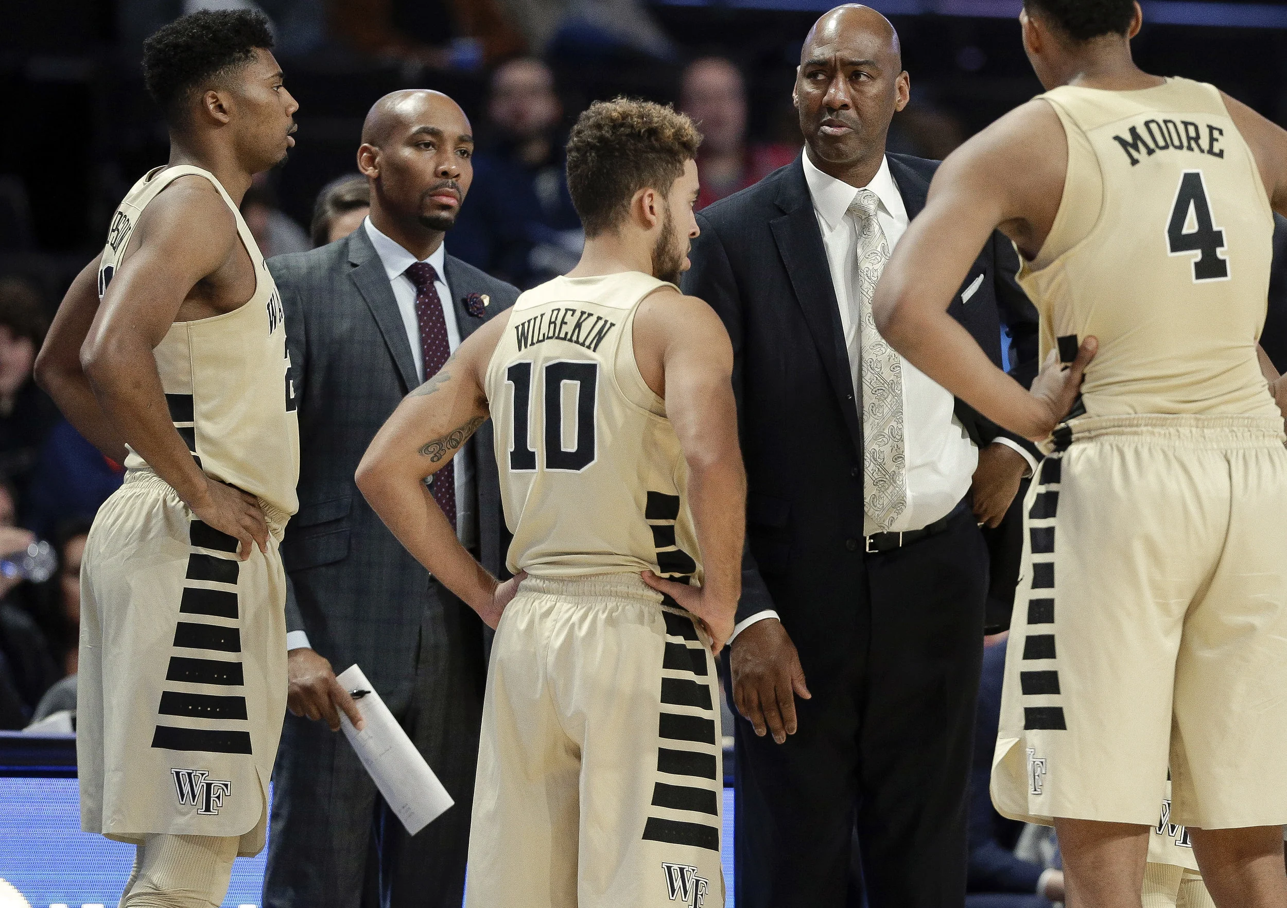 Former Wake Forest assistant coach Jamill Jones, second from left, with the team and head coach Danny Manning, second from right, during the second half of an NCAA basketball game. Prosecutors says Jones threw a punch that killed a tourist in Long Island City. AP Photo by Chuck Burton.
