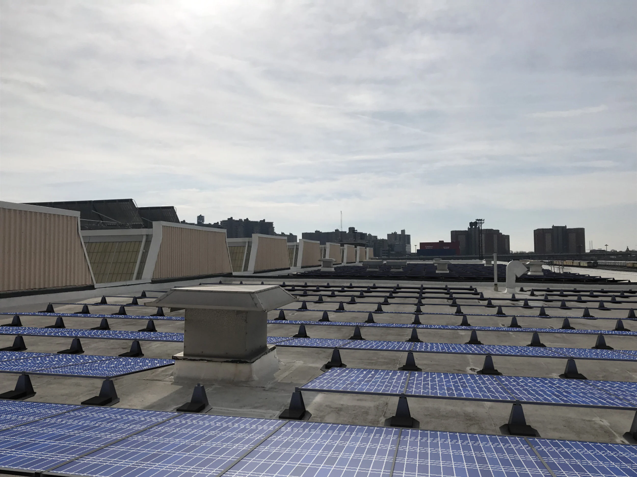 The MTA would place solar panels on the roofs of certain MTA structures, such as the Coney Island Maintenance Facility, under a new proposal. Rendering courtesy of the MTA.