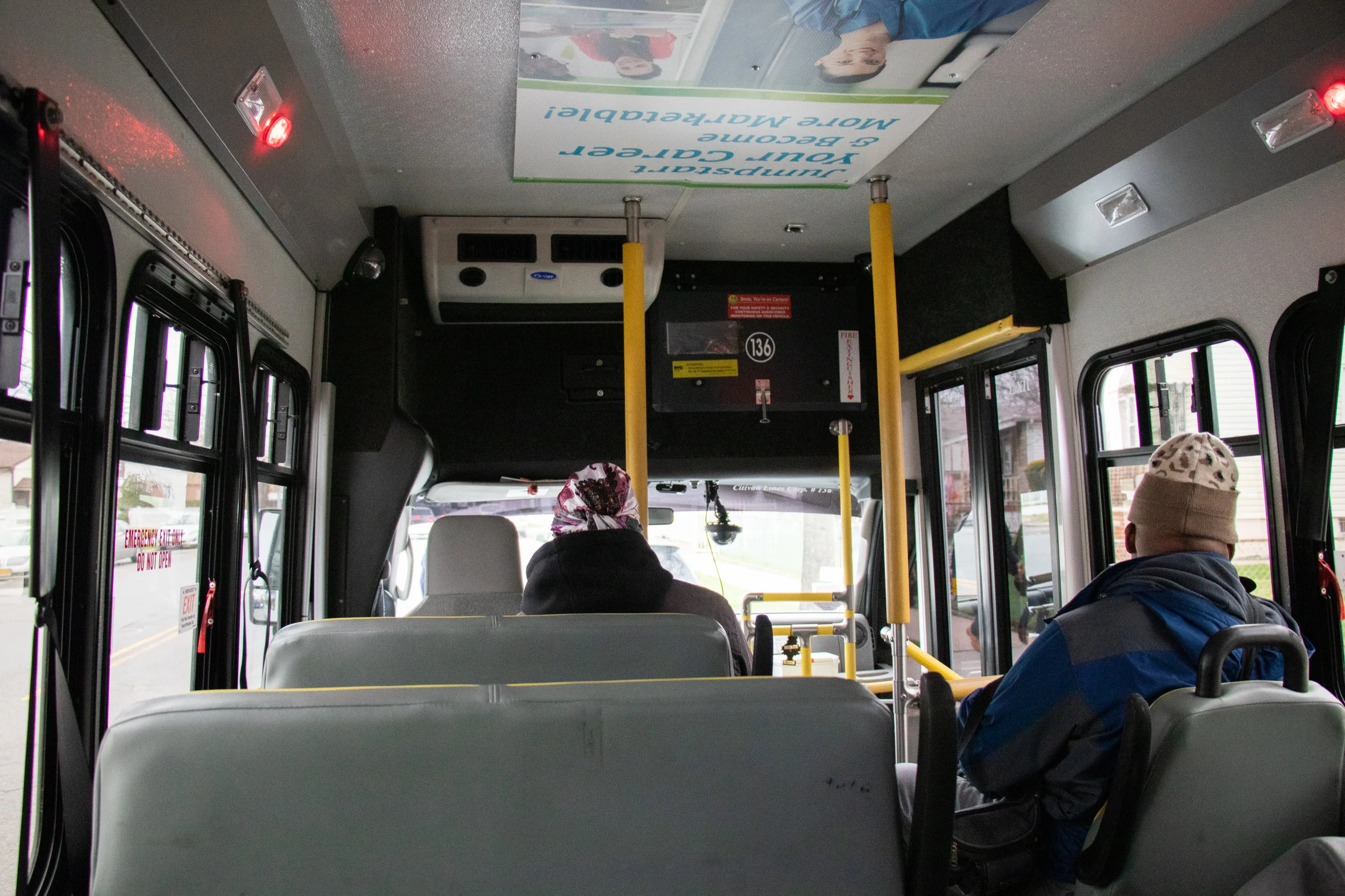 Each dollar van driver has their own style — some greet riders with the radio station of the driver's choice, while others have TVs that play movies. Eagle photos by Angel Torres.