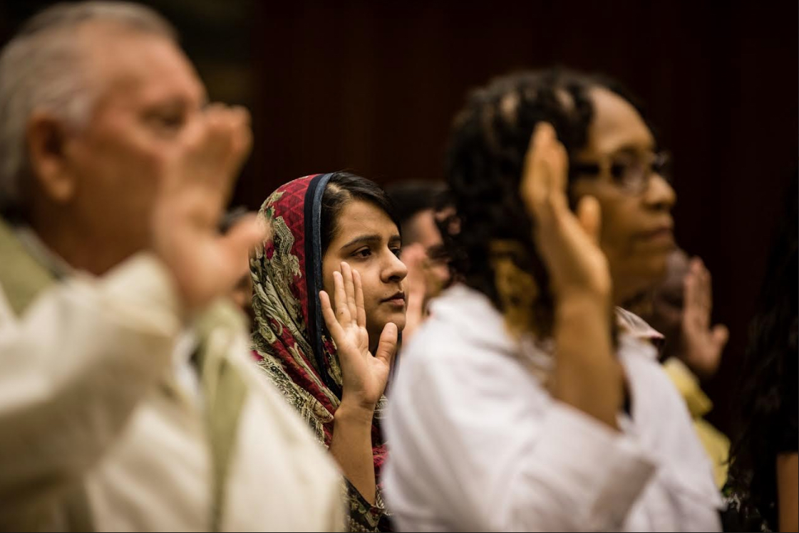 New citizens take the Oath of Allegiance at a special ceremony on Citizenship Day in Brooklyn Federal Court last year. Eagle file photo by Paul Frangipane