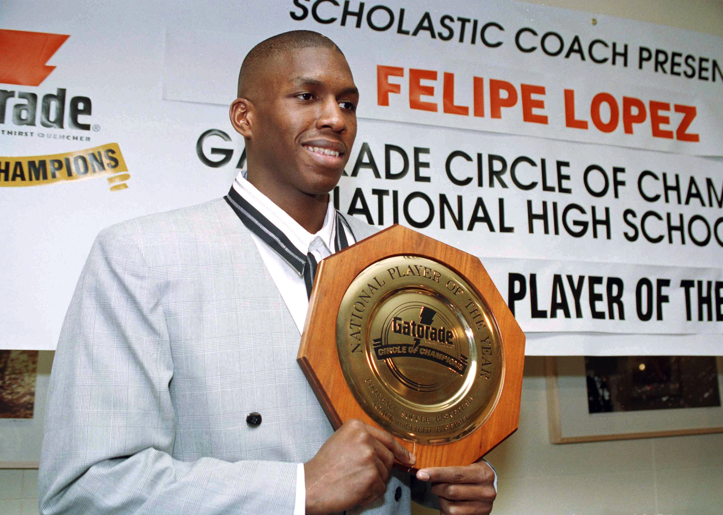 In this March 15, 1994 file photo Felipe Lopez, a senior at Rice High School in the Bronx, is named National High School Basketball Player of the Year. Lopez, once the top-rated player in the nation in high school, went onto a four-year career at St. John’s University, but could never live up to the lofty expectations in college or the NBA. His story is told in the new film “The Dominican Dream.” (AP Photo/Marty Lederhandler, File).