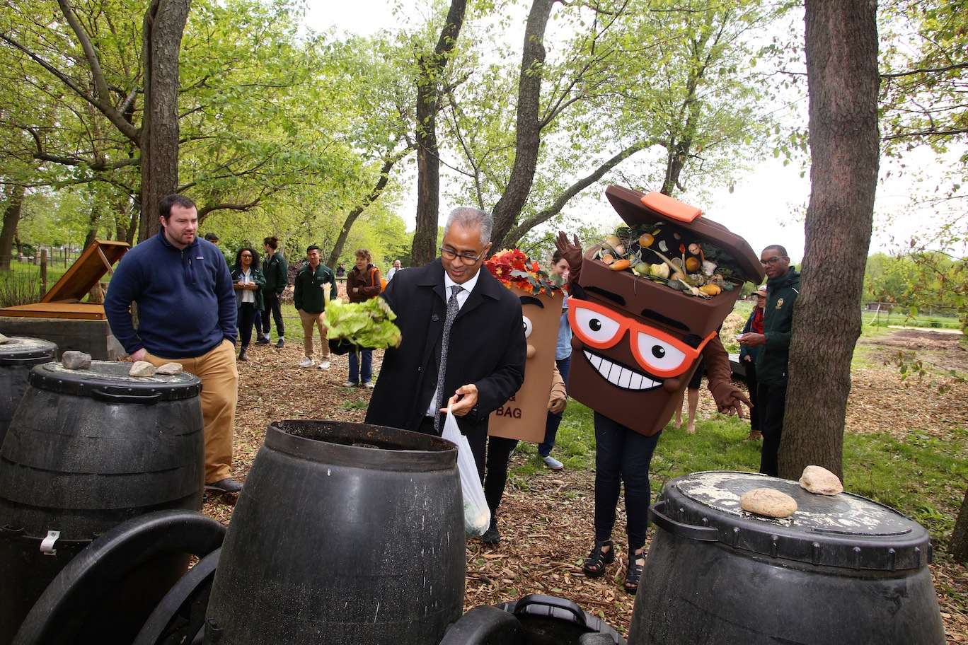 From left, Queens County Farm Executive Director Jennifer Walden Weprin, DSNY Deputy Commissioner of the Bureau of Recycling and Sustainability Bridget Anderson, Scrappy the Brown Bin, Leif the Lawn Bag, DSNY Acting Commissioner Steven Costas, and DSNY Chief and Director of Cleaning and Collection Edward Grayson.