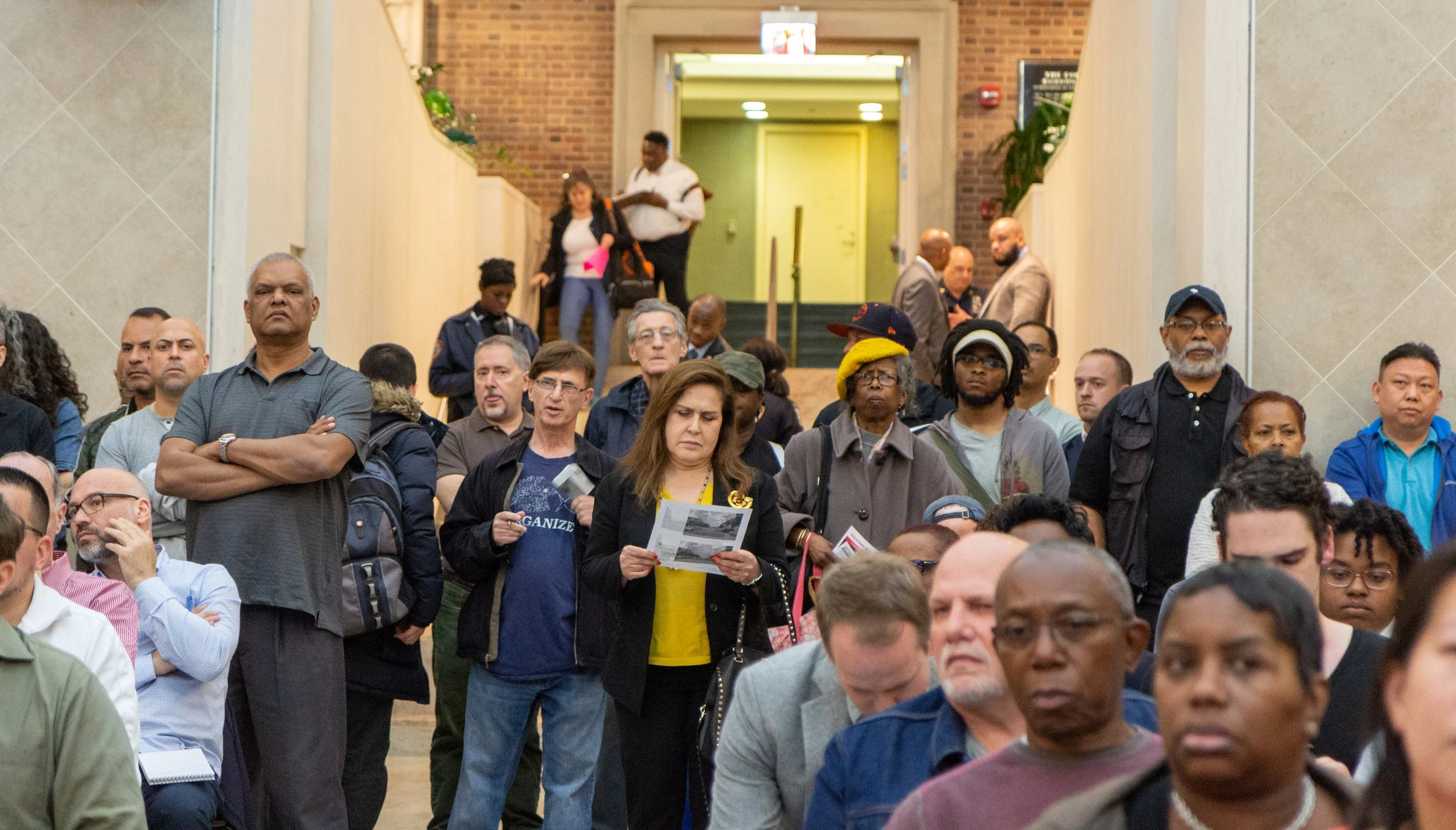 A standing-room-only crowd attended a public hearing on the city’s plan to build a new jail in Kew Gardens last month. Eagle photo by Jonathan Sperling