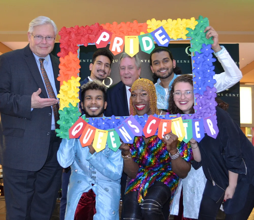 Former NY State Senator Thomas "Tom" Duane (standing, far left); top row: LGBTQ activist and social worker Brian Romero, Council Member Daniel Dromm, dance artist Rajeev Singh; bottom row: dance artist Sean Kulsum, vocalist Anthony Wayne, and Generation Q Director Lindsey Duel celebrate LGBT Pride at Dromm's annual event at Queens Center Mall. Photo courtesy of the Office of Daniel Dromm.