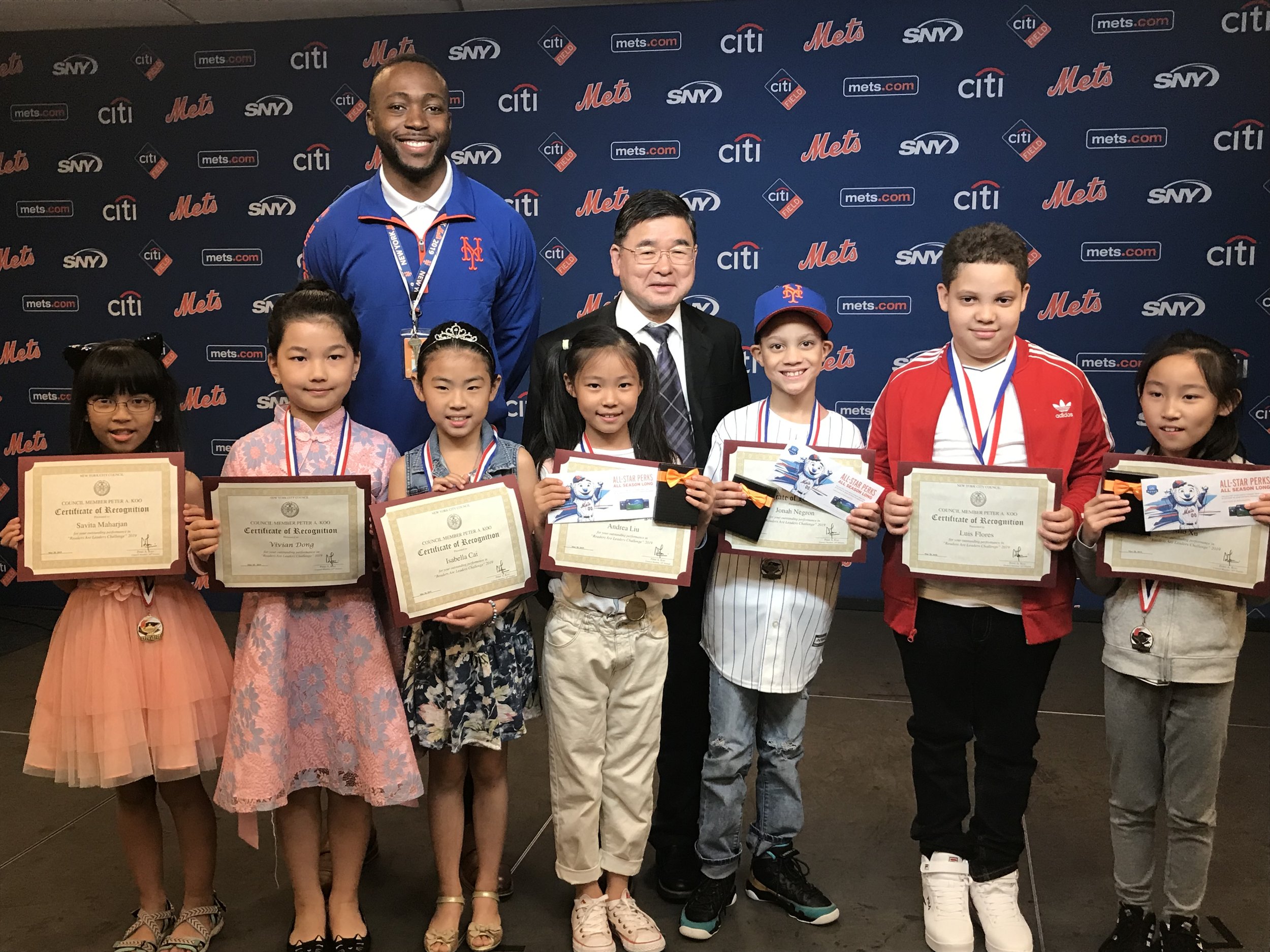 Councilmember Peter Koo (back row, center) presented the 10th Annual Readers Are Leaders Challenge awards to seven Queens third-graders. Photo courtesy of Koo’s Office.