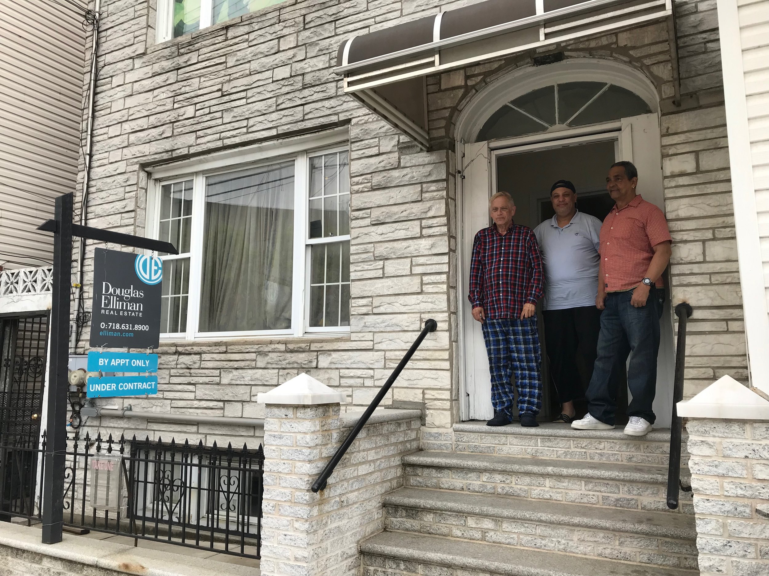 Bill Lindauer (left), Khamis Mohamed (center) and Edwin Amadeo face an uncertain future at their Long Island City apartment building. Eagle photos by David Brand.